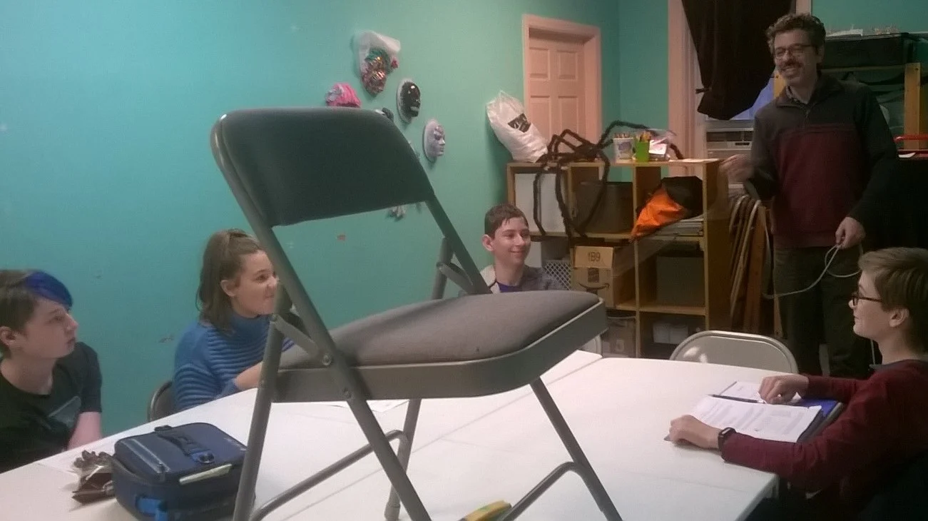 What is the chair doing on the table? Don’t worry — it’s science class.