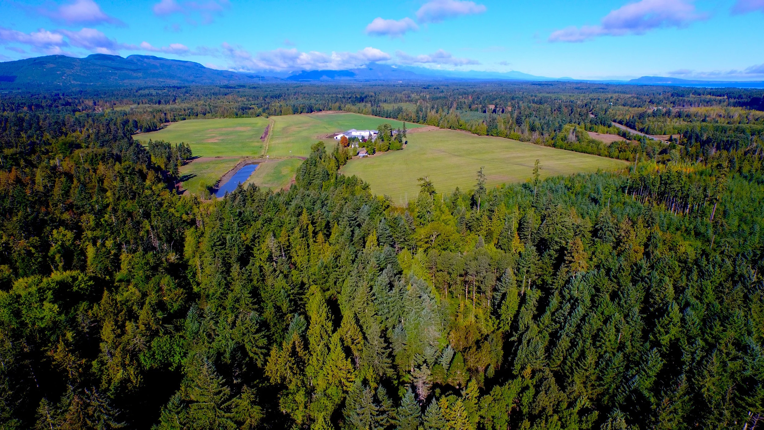 Farm at the foot of Mount Arrowsmith by Arrowsmith Aerial Photography
