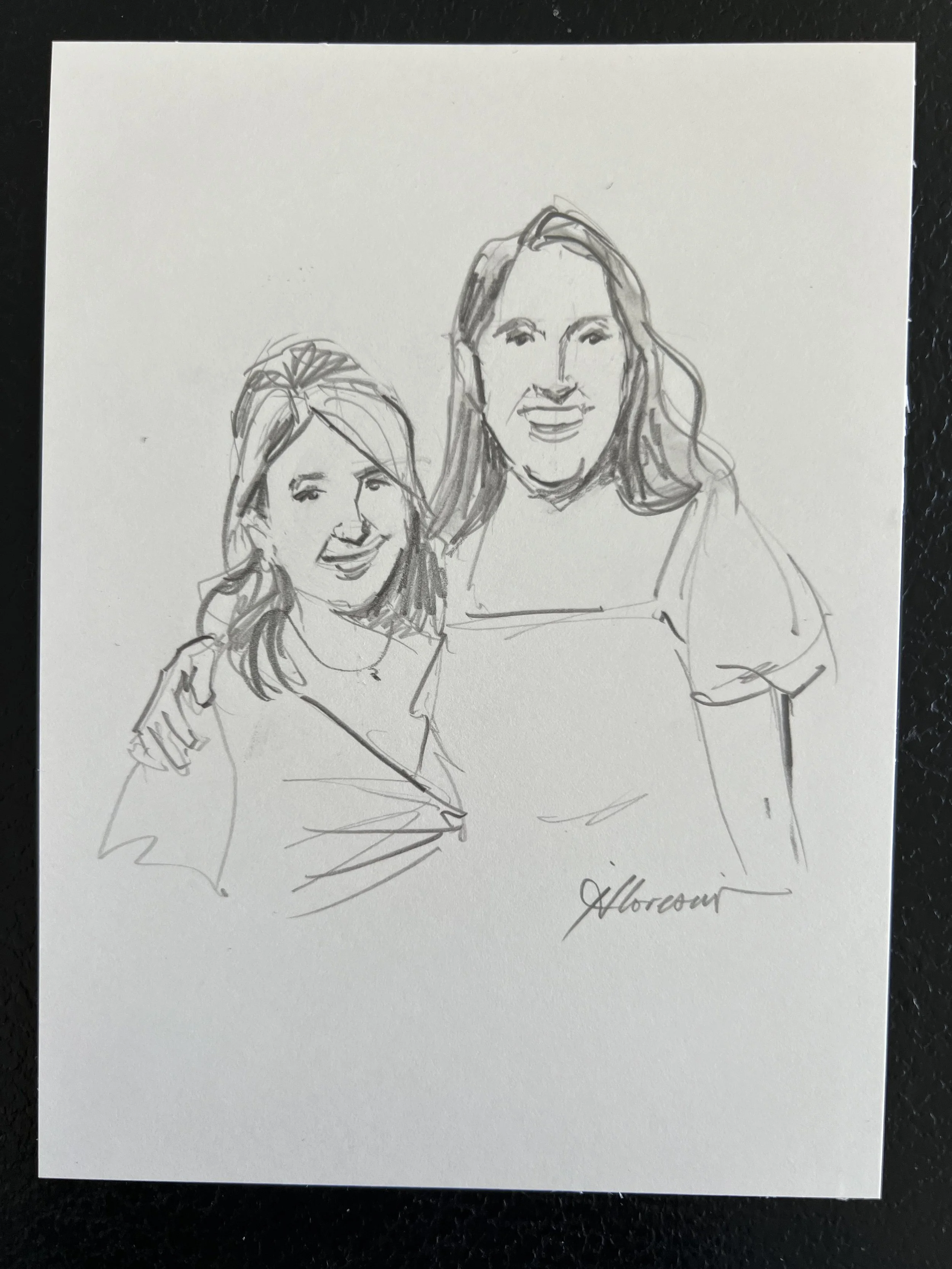 A sketch of two women smiling, with one having her arm around the other, signed by H. Moore.