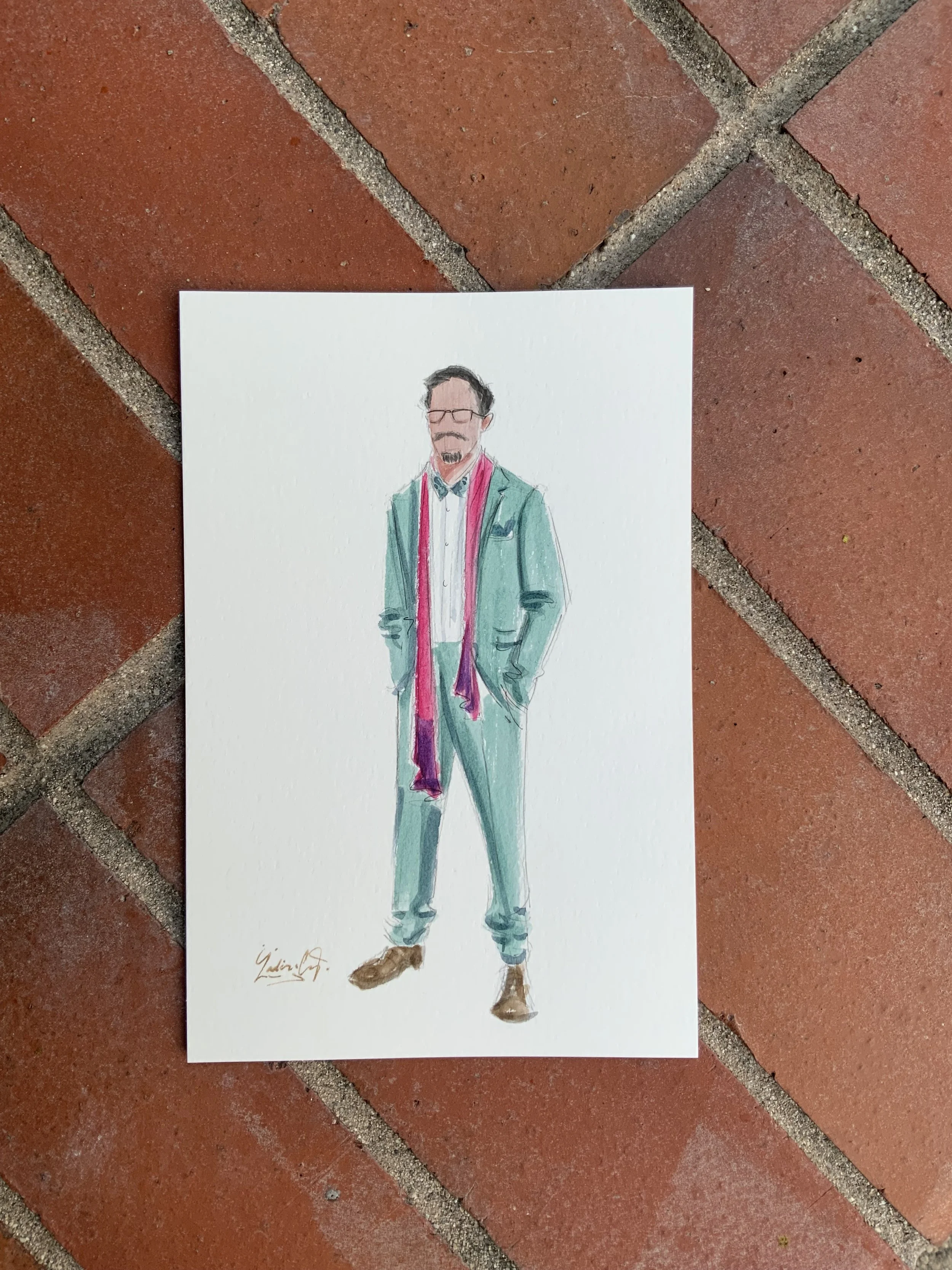 A watercolor illustration of a man in a teal suit, white shirt, with a pink scarf, wearing glasses, with hands in pockets, standing on a brick floor.