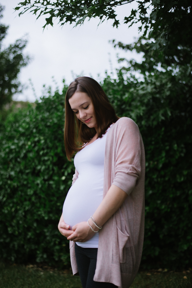 Beautiful maternity portrait of mom embracing her baby belly in Banbury.