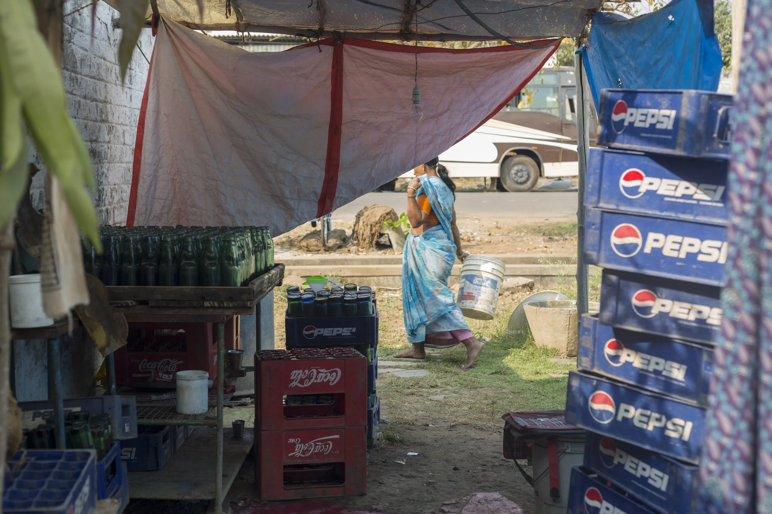 Aseefa begins her day by sorting out the bottles, washing and unclogging them.