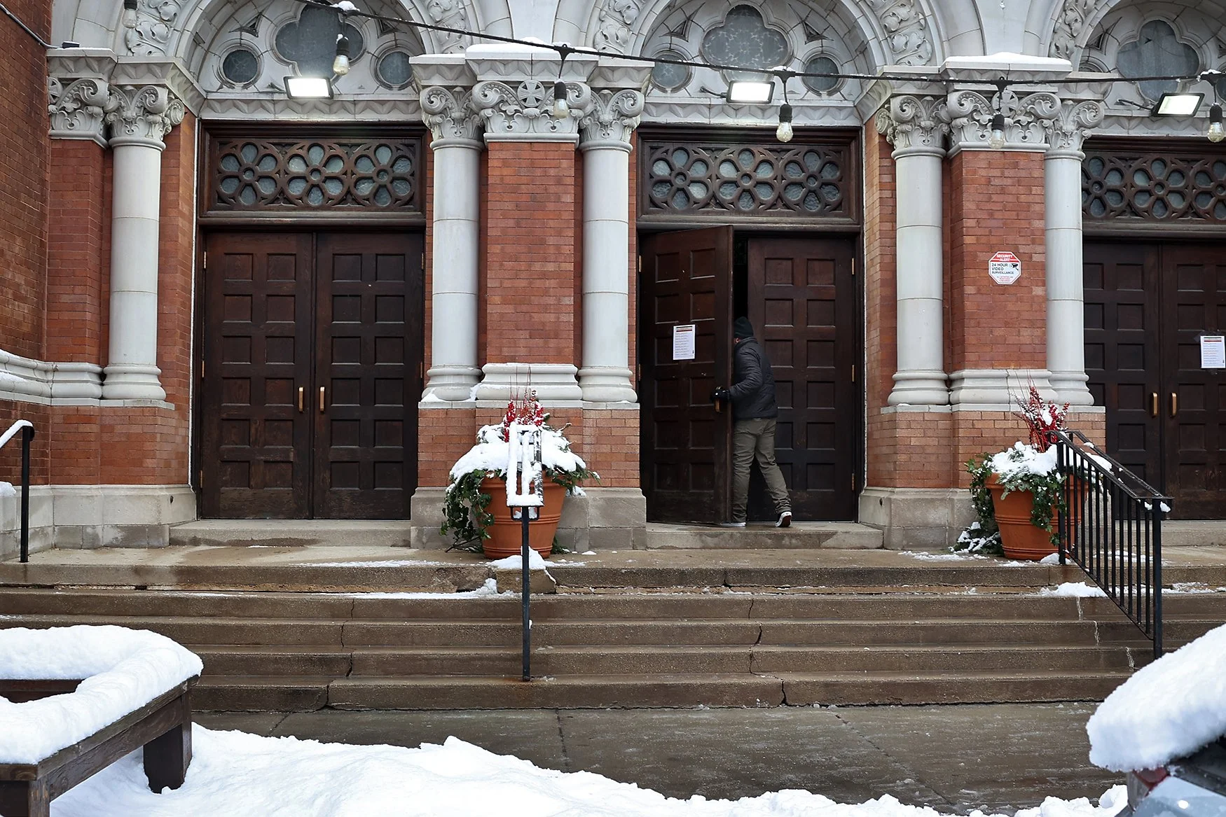 Someone walks through the doors for Mass on Sunday, Dec. 7, 2025, at St. Joseph Parish in the Back of the Yards.