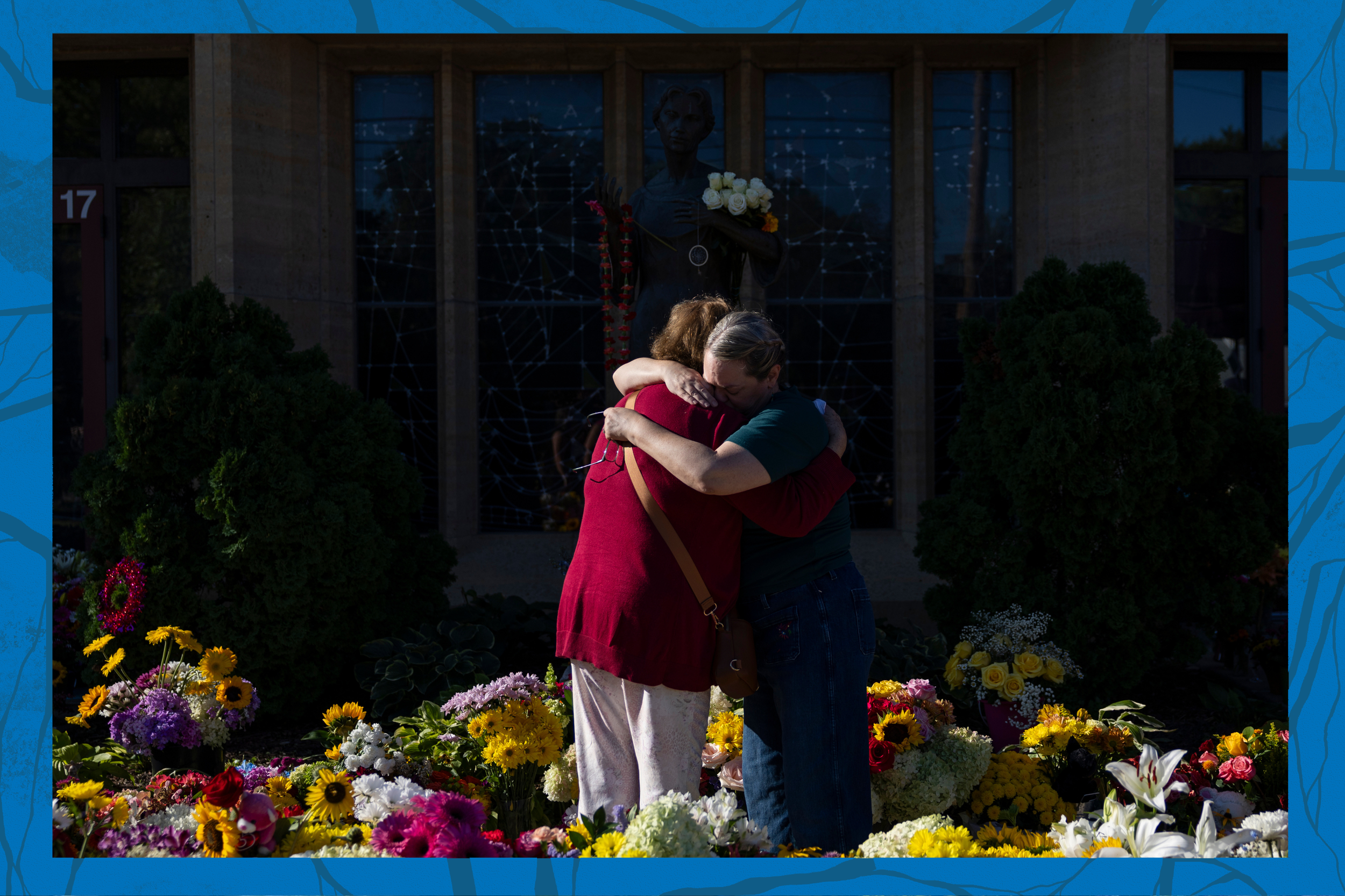 Women embrace at the memorial outside the Annunciation Catholic Church following a shooting at the school, Aug. 31, 2025, in Minneapolis. (AP Photo/Ellen Schmidt, File)