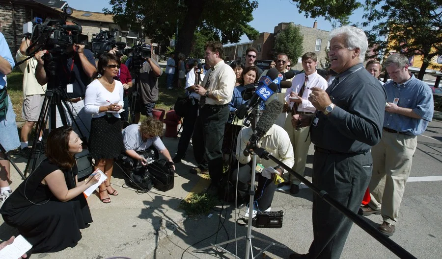 Camden, pictured in 2003 during his time as a CPD spokesman, has often been the only voice of authority talking to reporters immediately after a police shooting. (Tim Boyle/Getty Images)