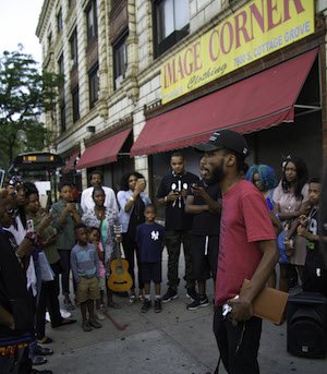 Charles Preston (right) speaks to a group at Church on the 9 (Photo by Christopher ThoughtPoet Brown) 
