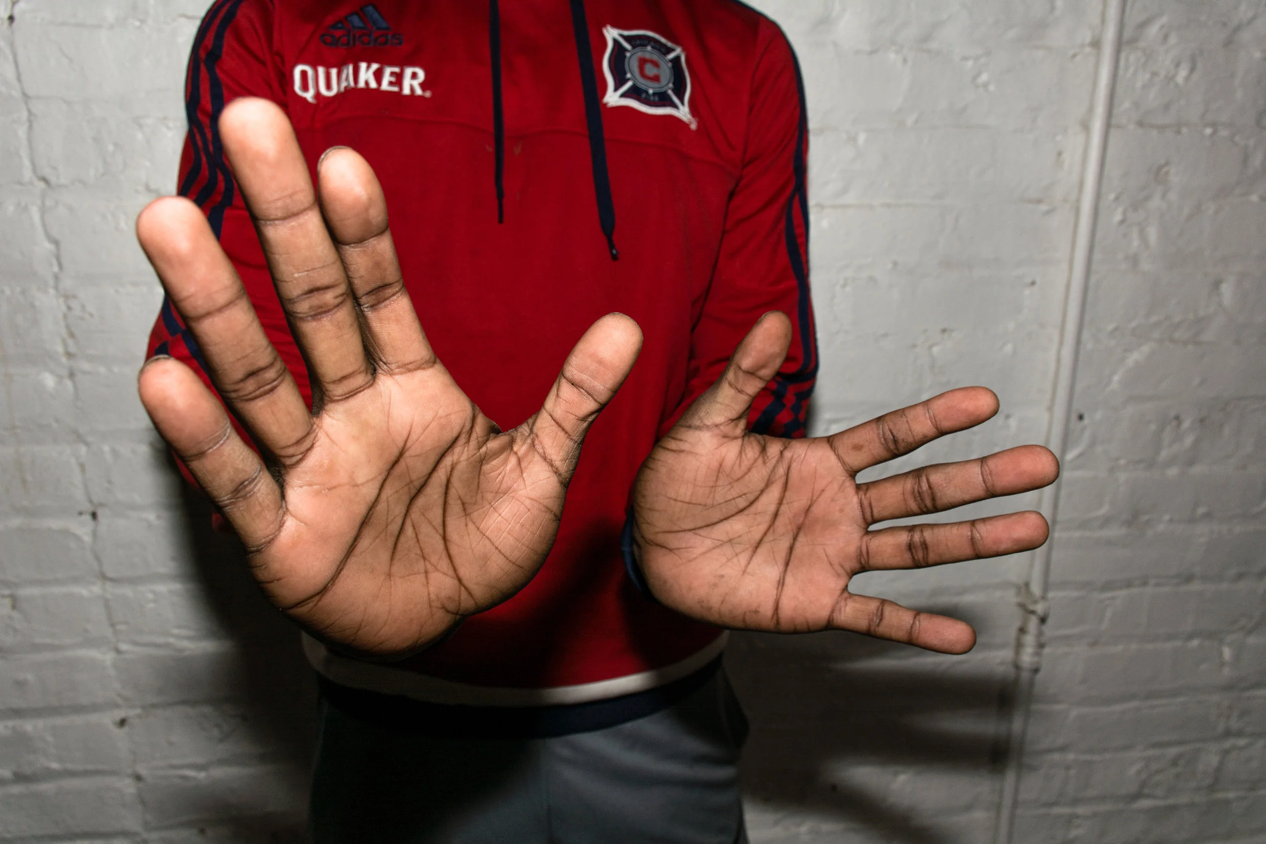 Manny displays his hands for a portrait on September 5, 2017 after work. An ex-boxer in his youth, he considers himself more of a chess player these days. "Chess makes you think about the situation you are in and what you can do to get out," Manny said. "It makes you think ahead. You can't just go off top and do the wrong move because it can hurt you." (Sebastian Hidalgo)