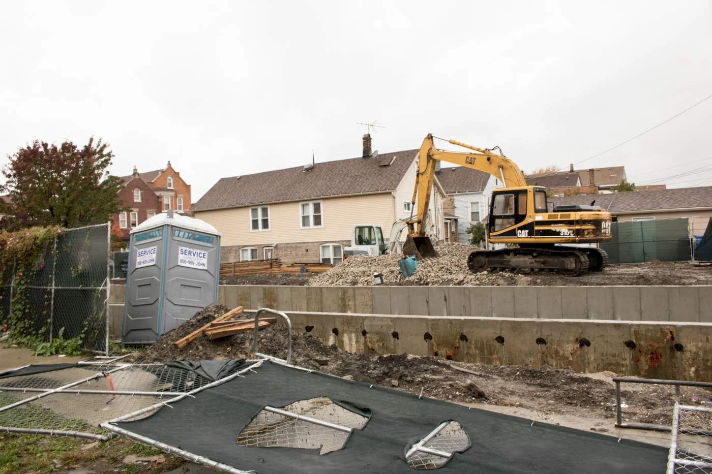 A backhoe lays the foundation for the construction of a new building at the site of the McKinley Park demolition that inspired Robert's question (Photo: Manny Ramos).