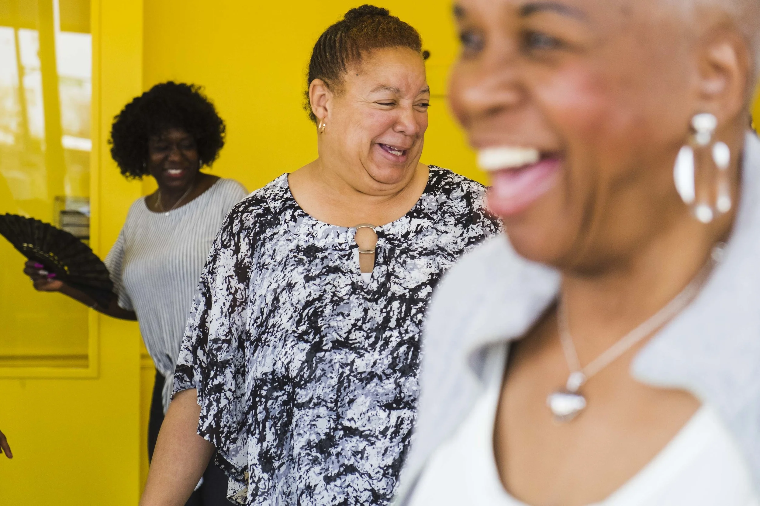 Older adults line dance at Mather's More than a Cafe in Chatham. The cafe, which caters to older adults but is open to all ages, serves affordable, healthy food and pay-as-you-go fitness classes (Photo: Pat Nabong).