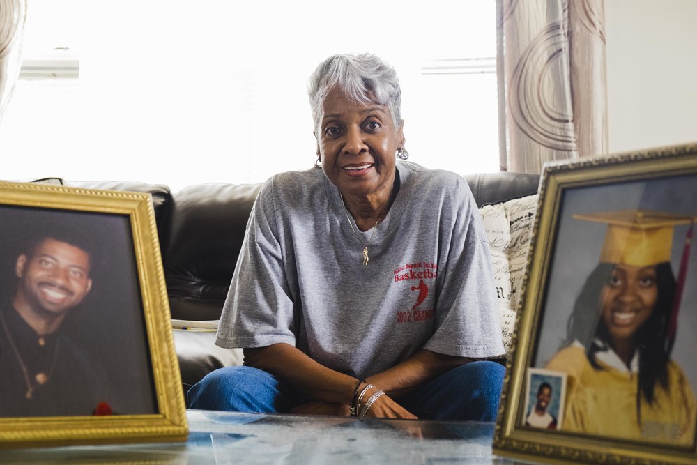  Eva Early, 73, lives alone in a senior building in Auburn Gresham. A framed photo of her granddaughter and late son are displayed prominently on her living room’s center table. The frames normally face the couch. “they here with me so I could watch 