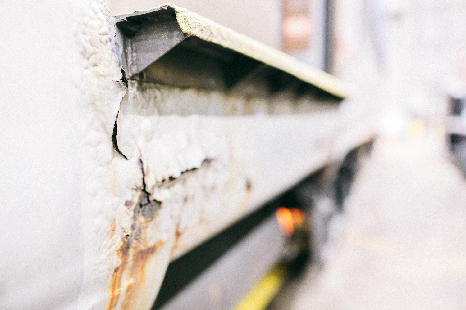 A close-up of rust on the exterior of an older railcar, which was made with carbon steel. This car was built in 1972. Modern cars are made with more durable stainless steel.