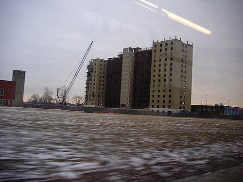 Public housing projects like the Robert Taylor Homes, pictured here during demolition, are one strategy for creating affordable housing. (Photo: Eric Allix Rogers/Flickr )