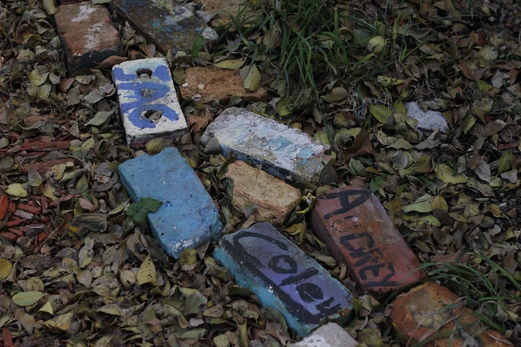 These bricks line the fences of one of the adopted lots in North Lawndale. The lot is used for a free summer camp for community kids, hosted by MMAD.