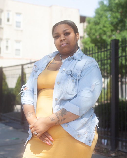 Titiana Milbrooks waits for the bus on her way to a job interview. (Photo: Samantha Cabrera Friend)