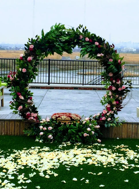 Mehendi Event Backdrop with fresh greens and roses