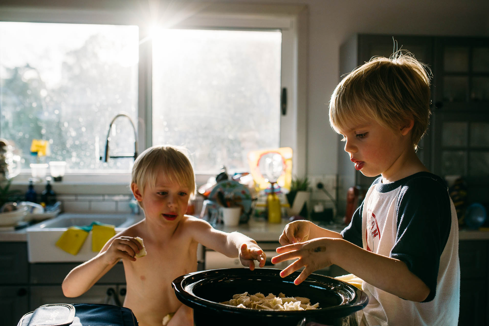 boys-helping-to-cook-together-in-kitchen