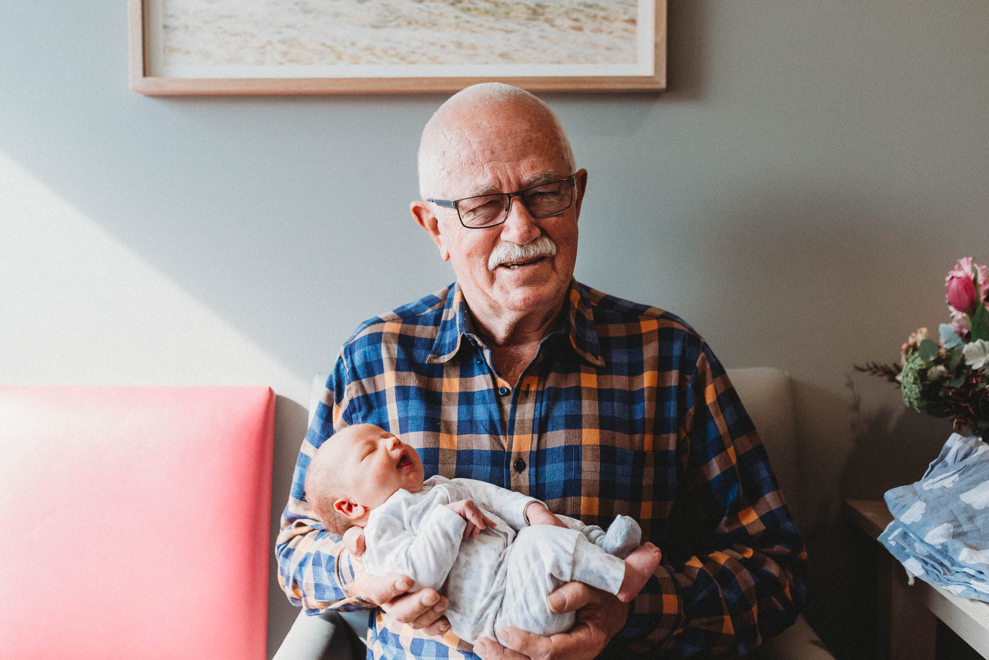 grandpa-holding-newborn-in-hospital-melbourne