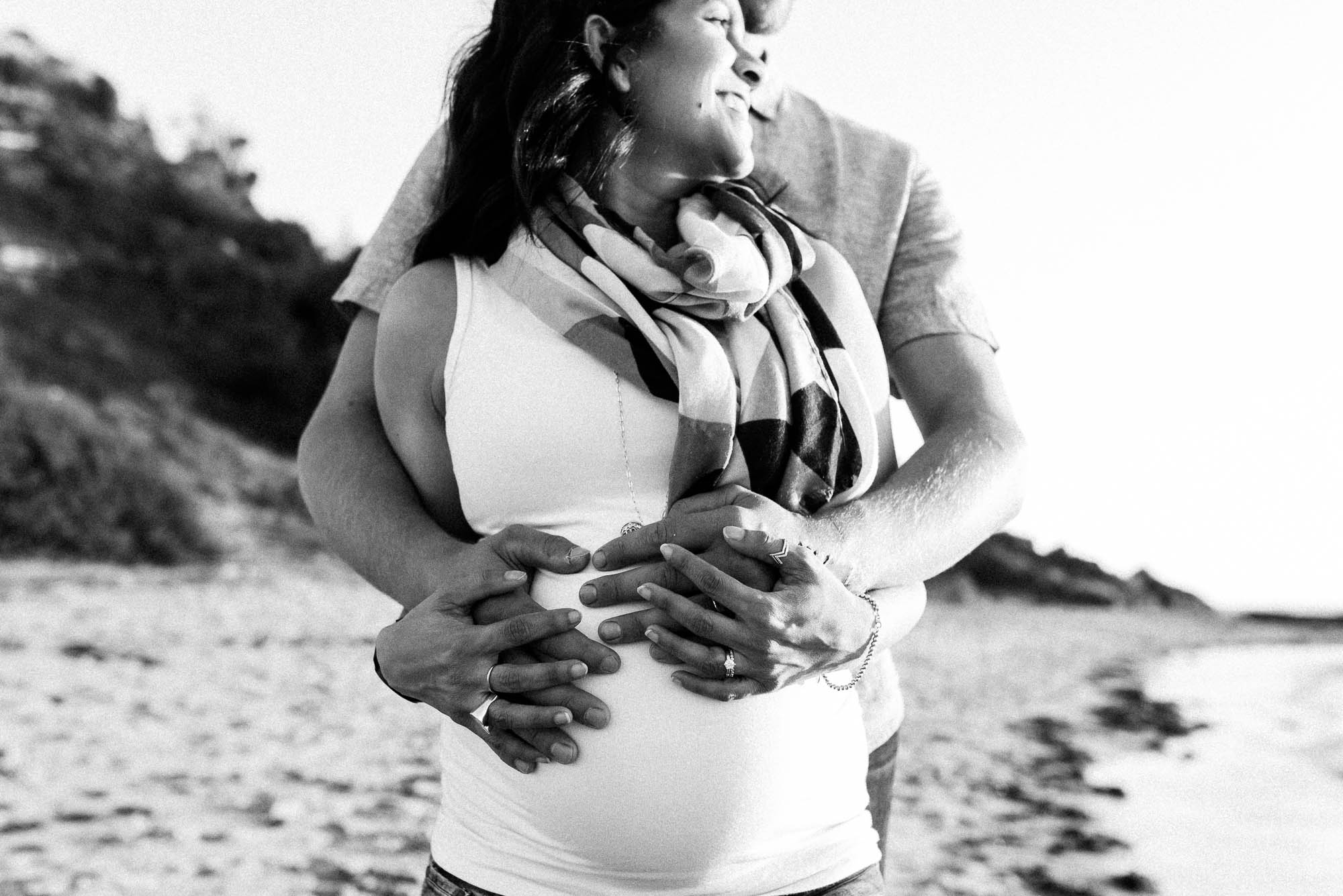 melbourne_maternity_photographer_jenny_rusby_photography_black_and_white_image_of_couple_standing_together_at_the_beach