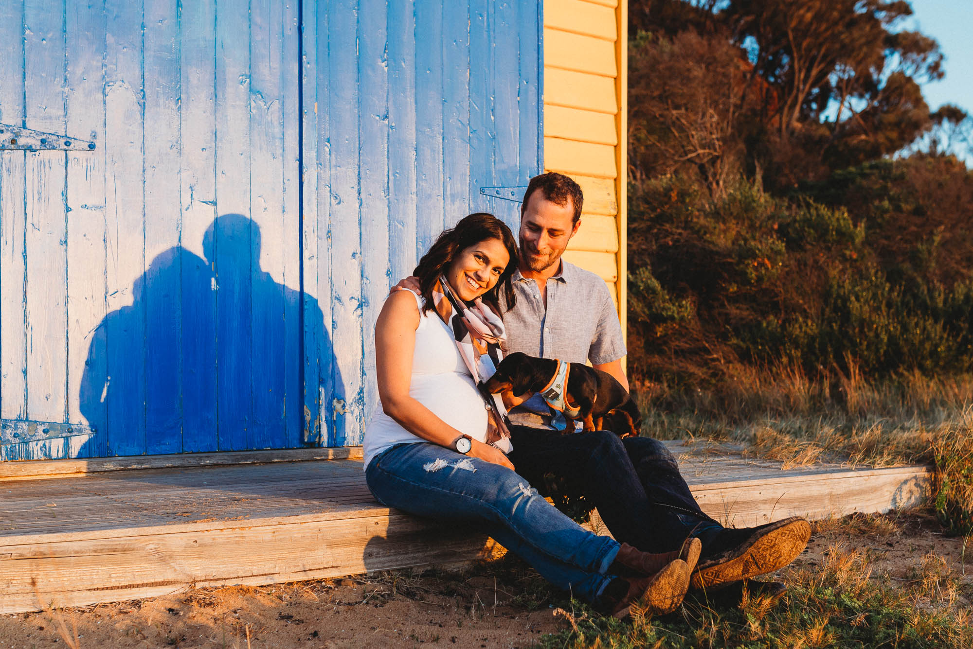 melbourne_maternity_photographer_jenny_rusby_photography_couple_sitting_together__with_dog_on_beach_box_at_the_beach_at_sunset