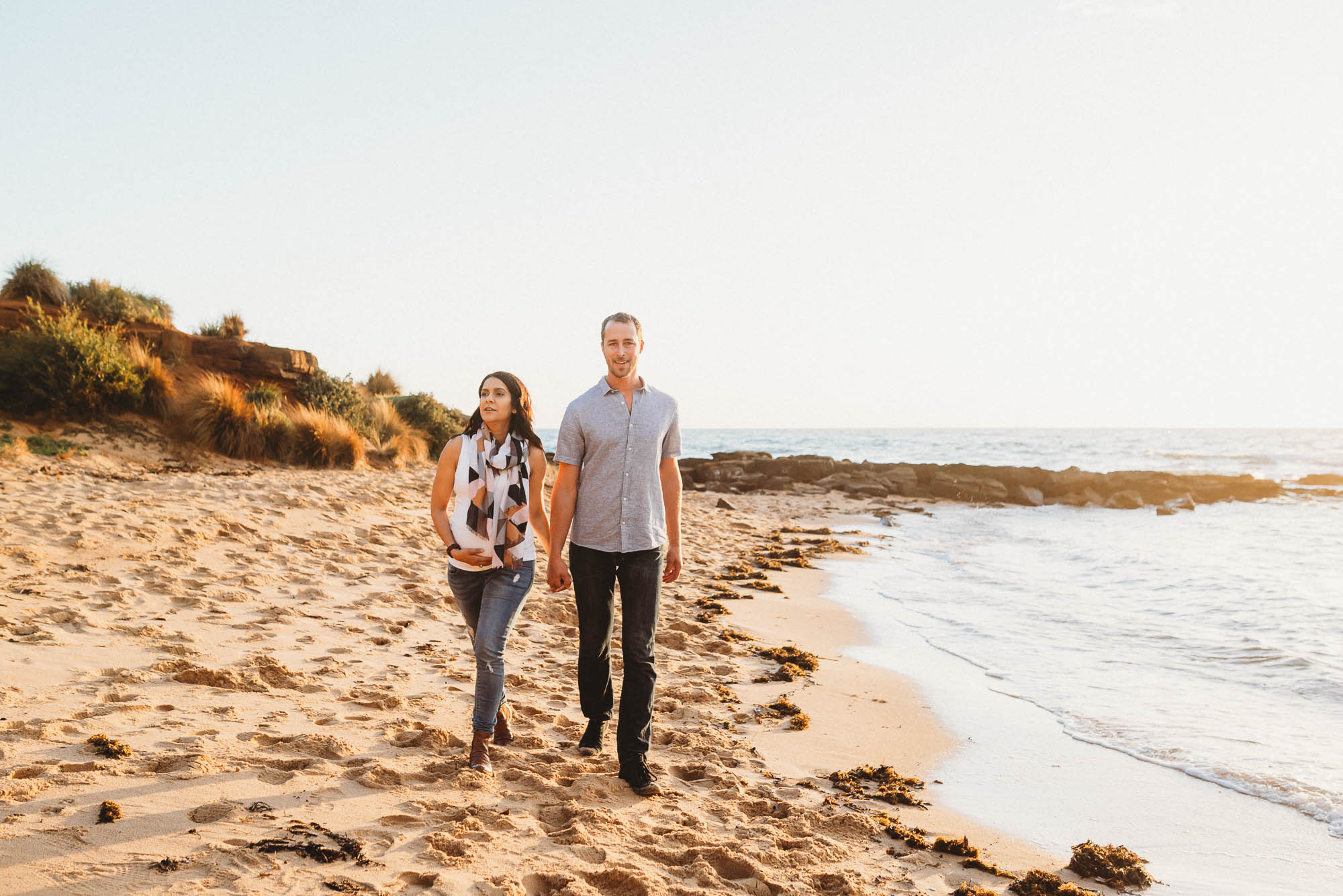 melbourne_maternity_photographer_jenny_rusby_photography_couple_walking_together_at_the_beach