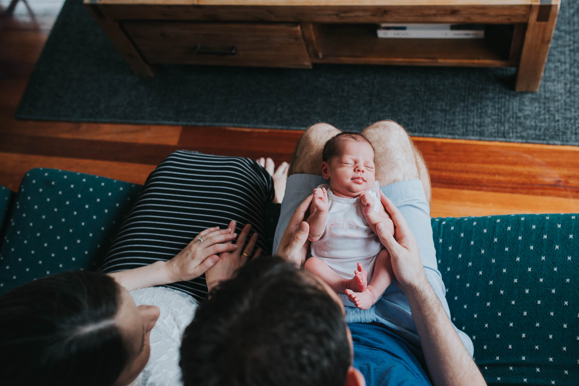 melbourne_newborn_photographer_newborn_sleeping_on_dad's_legs.jpg