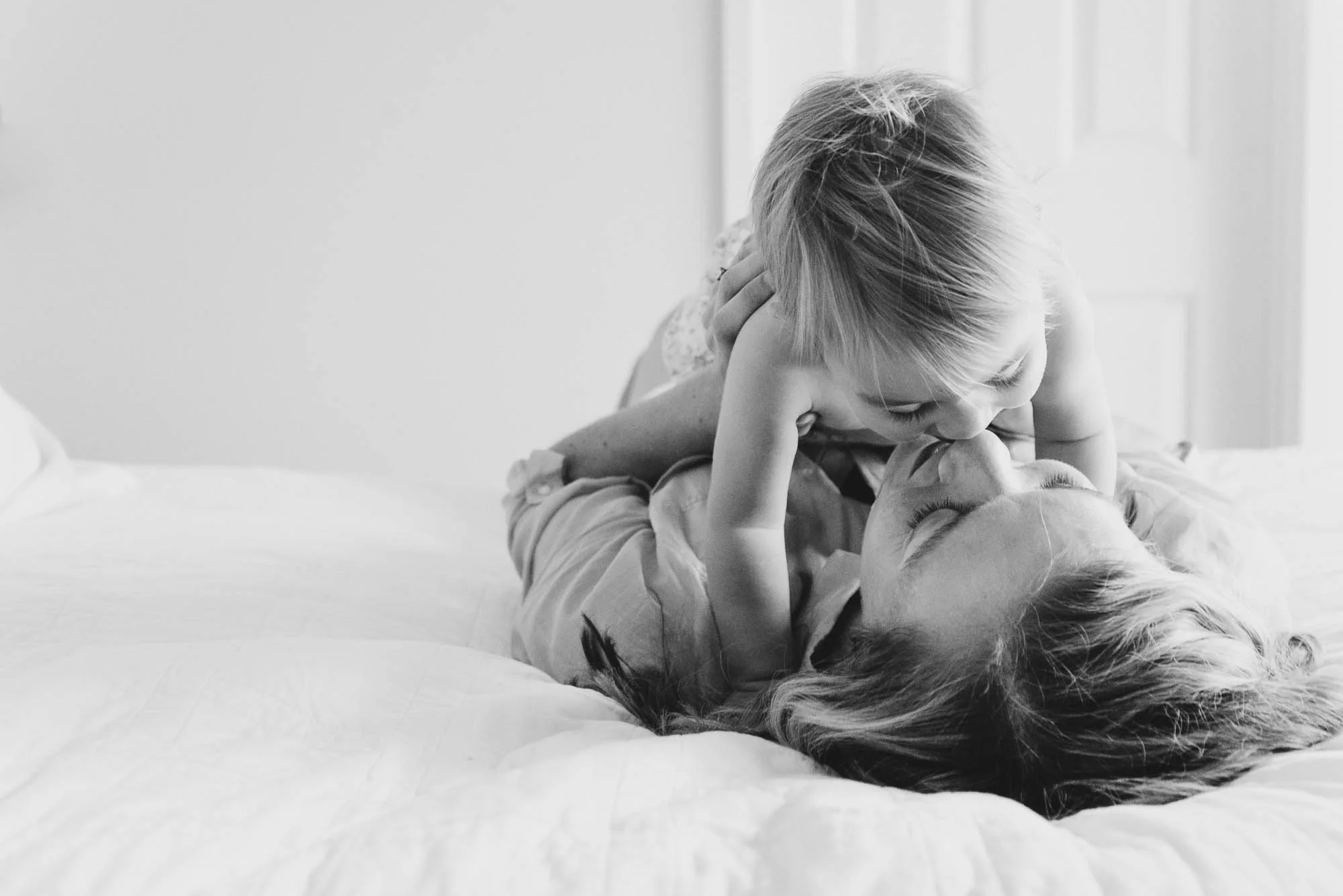 mum_kissing_her_baby_at_home_on_the_bed_melbourne_family_photographer-1.jpg