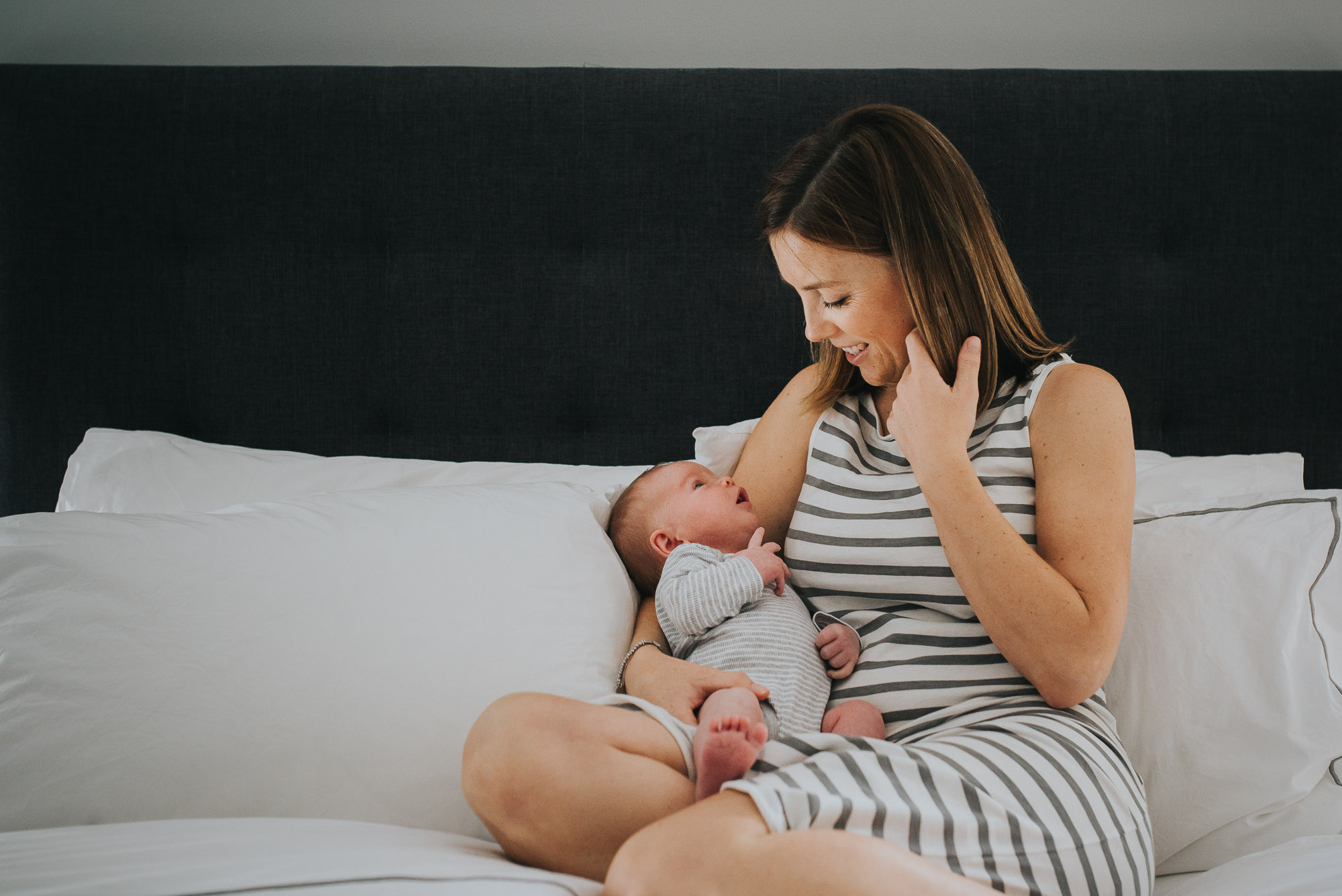 mum-and-baby-cuddling-on-a-bed-melbourne-newborn-photographer-jenny-rusby-photography.jpg