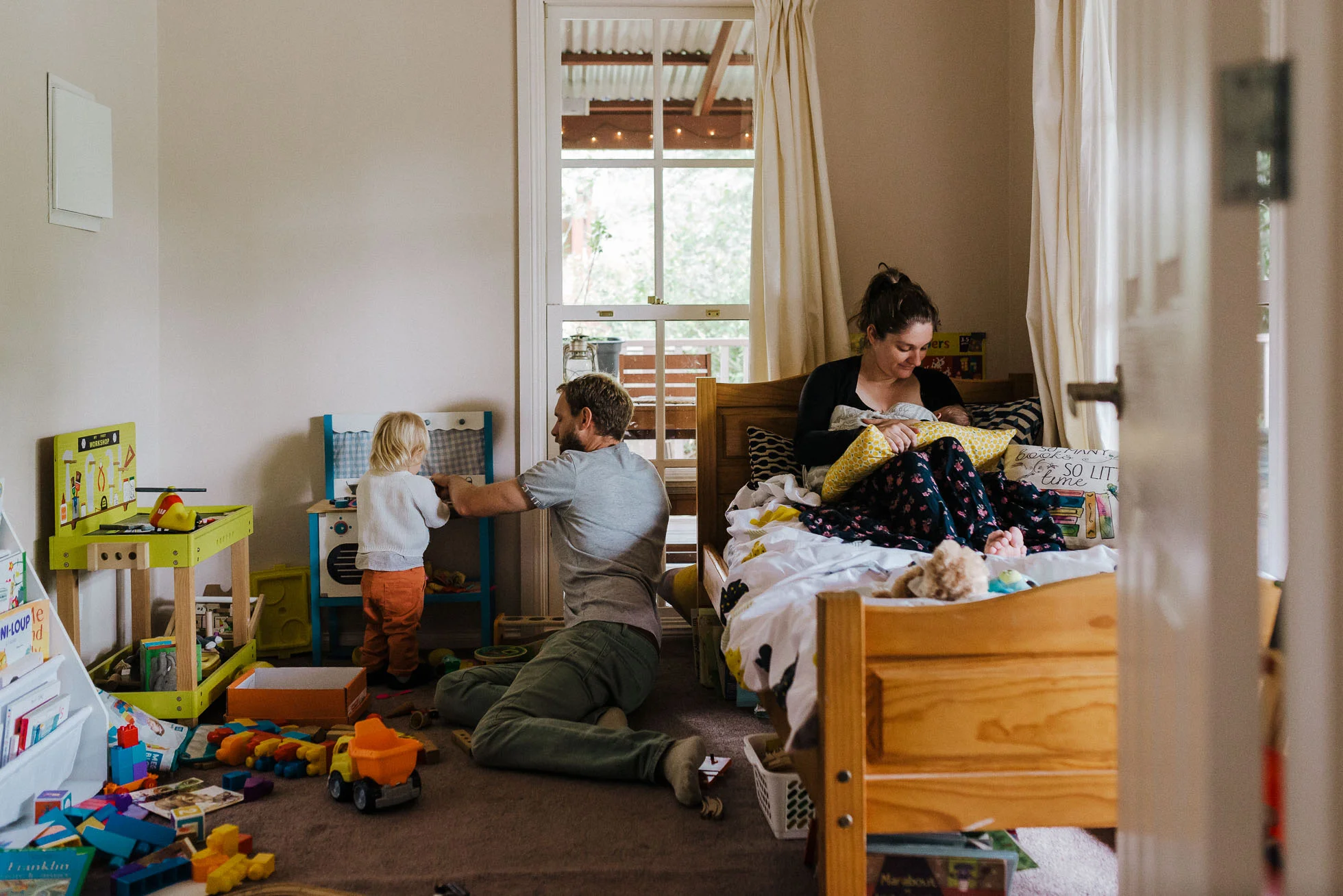 melbourne-family-photographer-family-playing-together-in-child's-bedroom.jpg