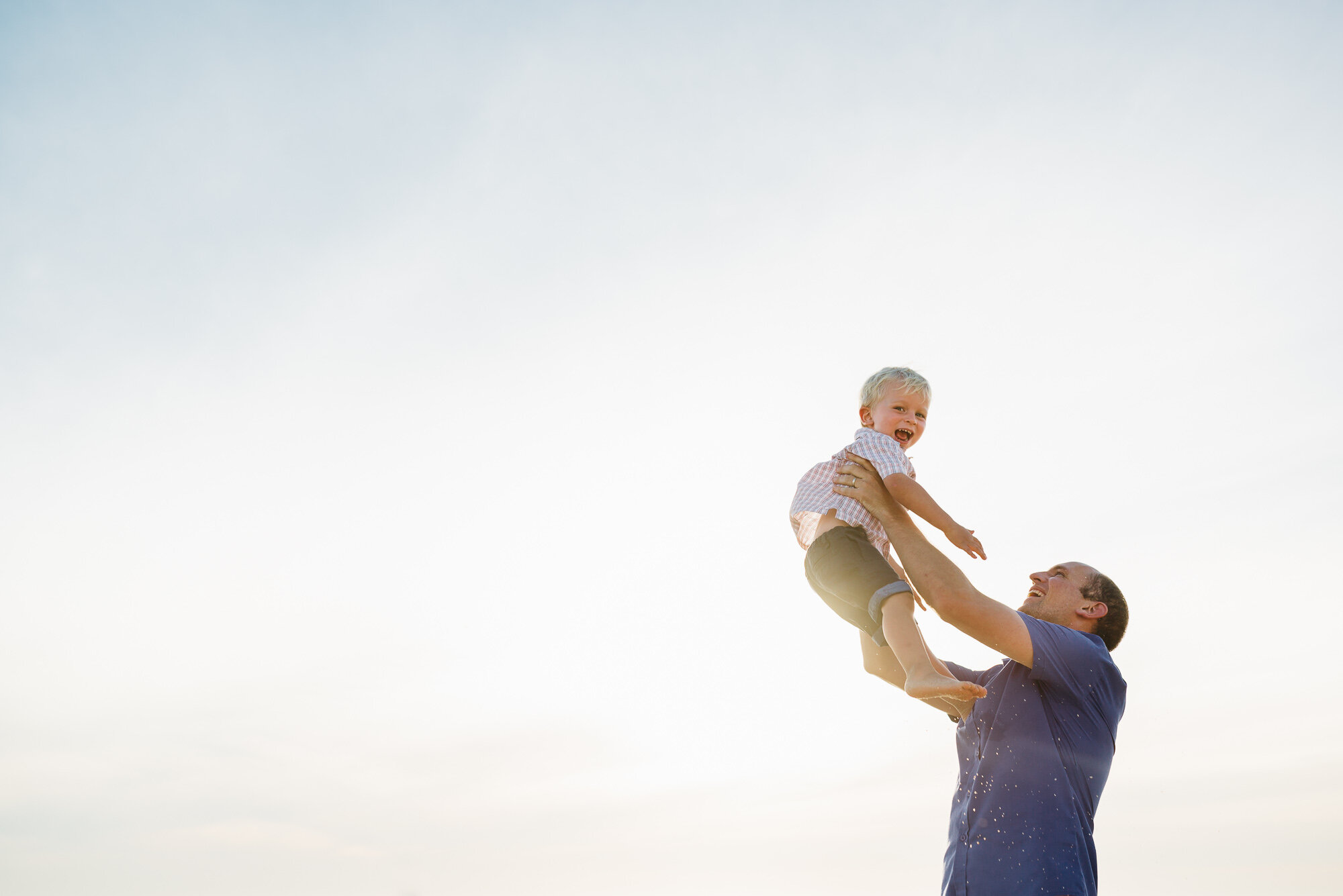 dad_lifting_son_up_in_the_air_fun_photographer_melboune.jpg