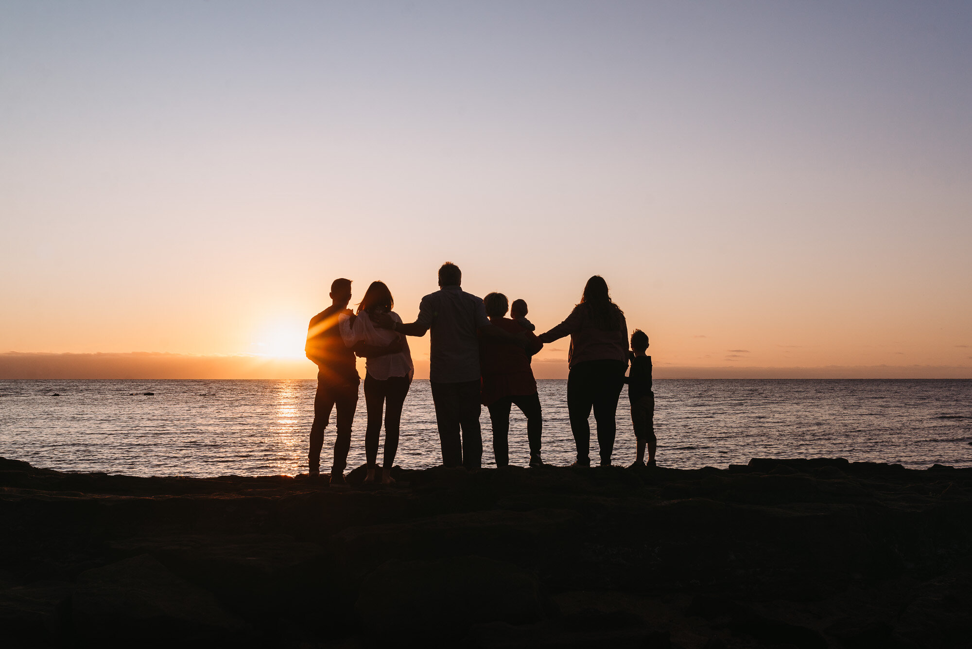 family_together_at_sunset_at_beach_melbourne_family_photographer.jpg