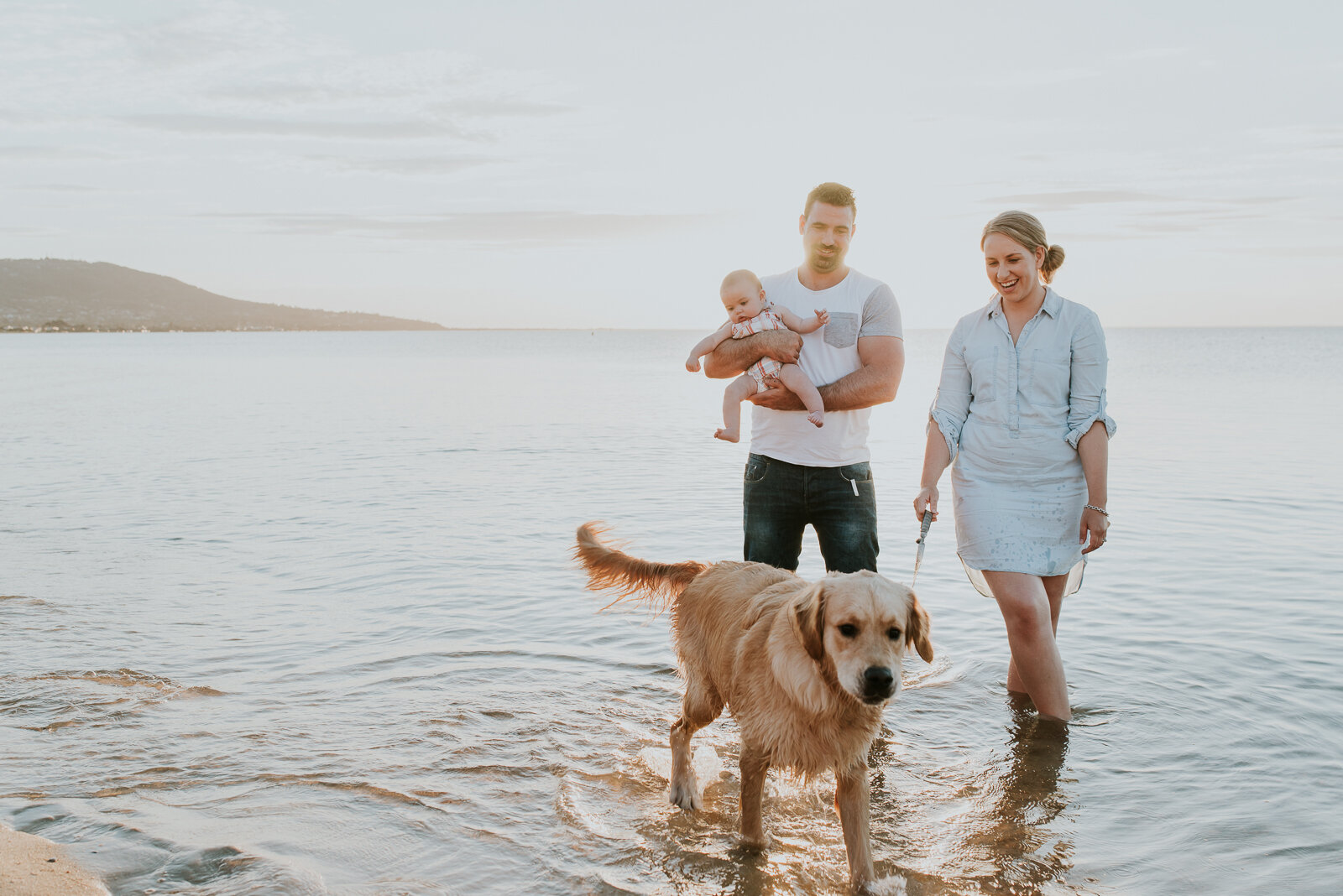 family_with_baby_girl_walking_dog_together_melbourne_family_photographer_beach.jpg