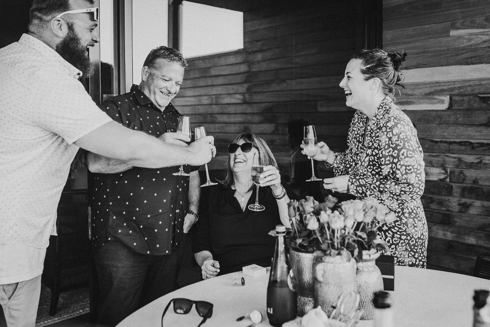 family_having_champagane_together_toastP_melbourne_family_photographer_in_home.jpg