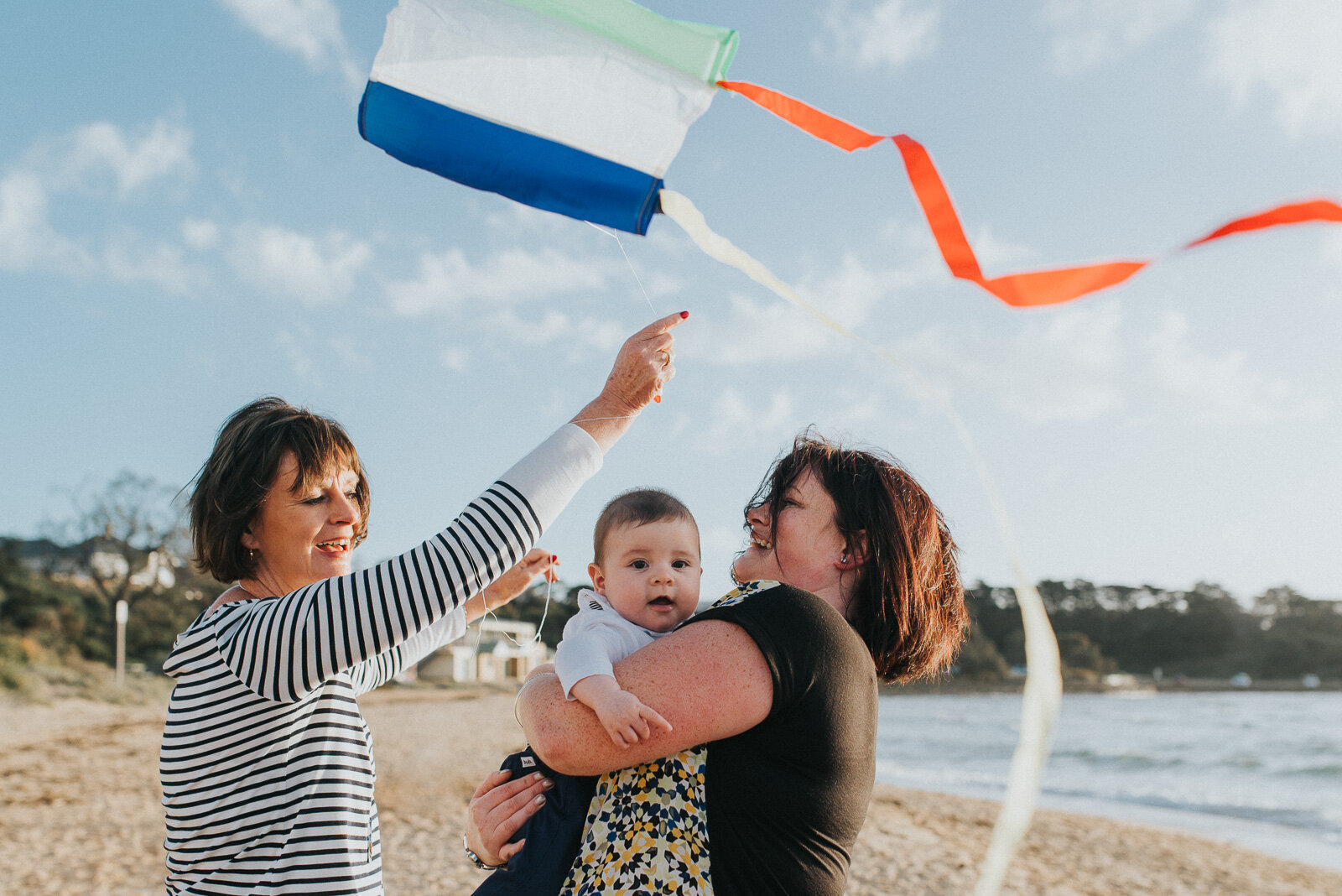 grandmother_mother_grandson_flying_kite_together_at_beach_melbourne_family_photography-13.jpg