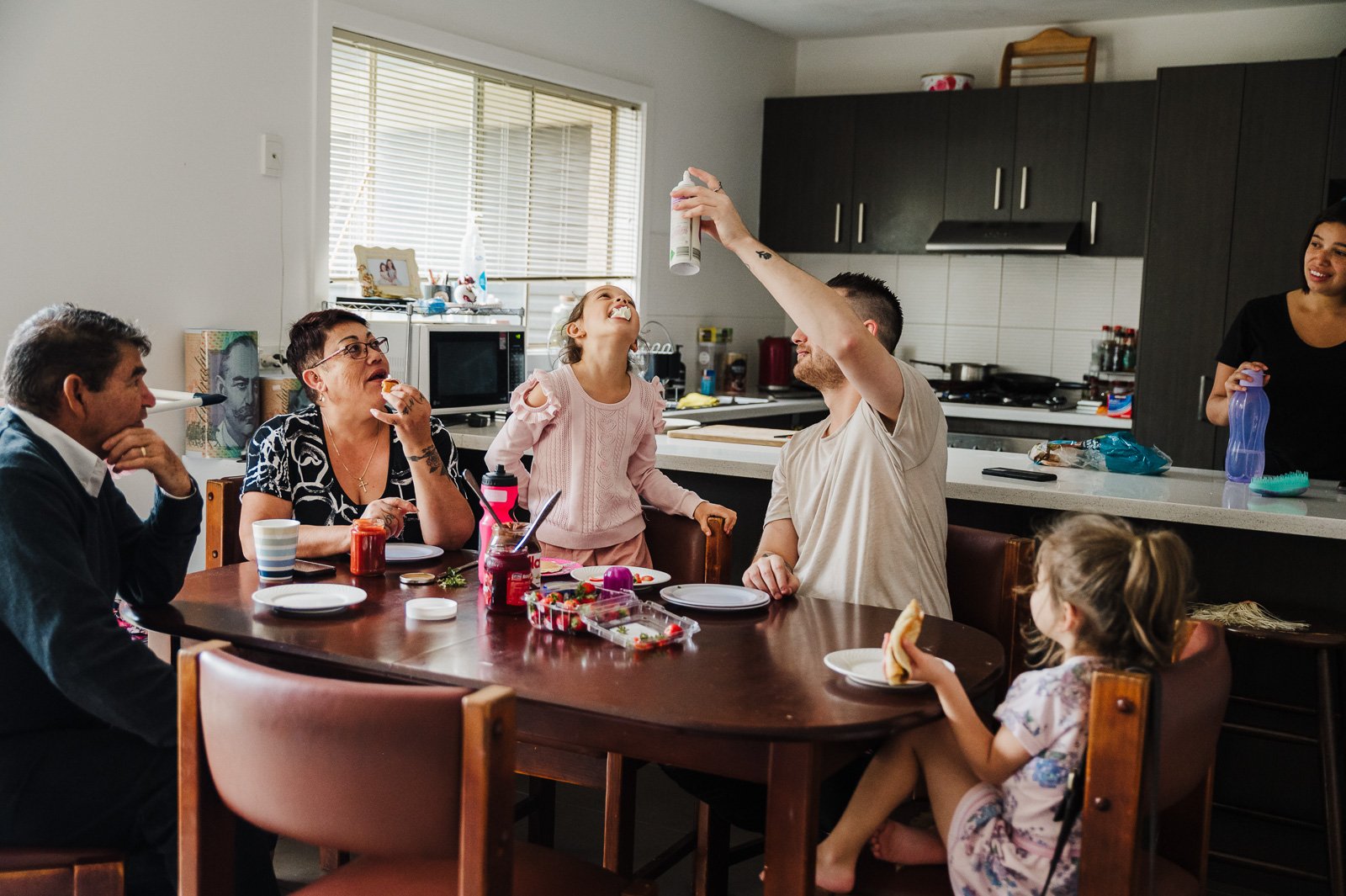 family_breakfast_at_table_whipped_cream_children_smiling_fun_melbourne-1.jpg