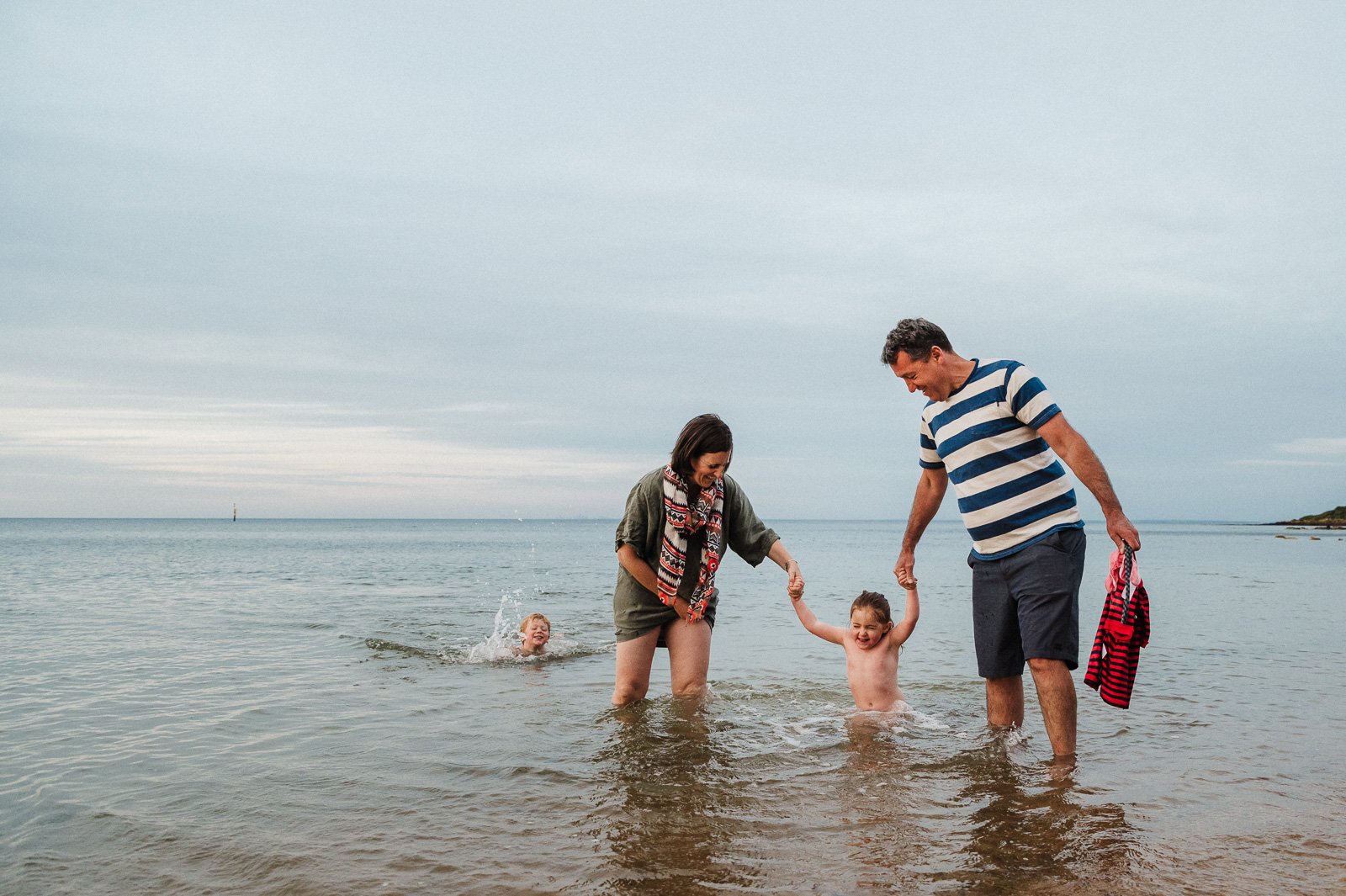 family_laughing_at_beach_in_water_kids_swimming_sunset_melbourne_mornington_peninsula_children_photographer-1.jpg