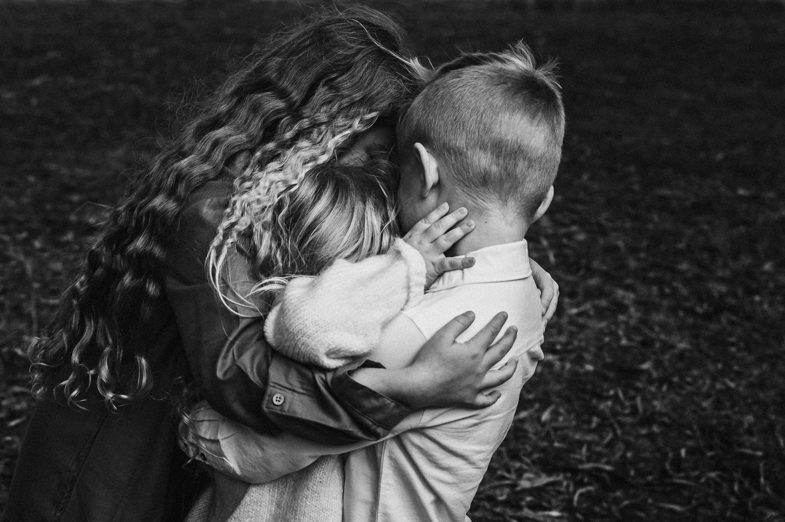 melbourne_family_photographer_together_children_hugging_hands_black_and_white-1.jpg