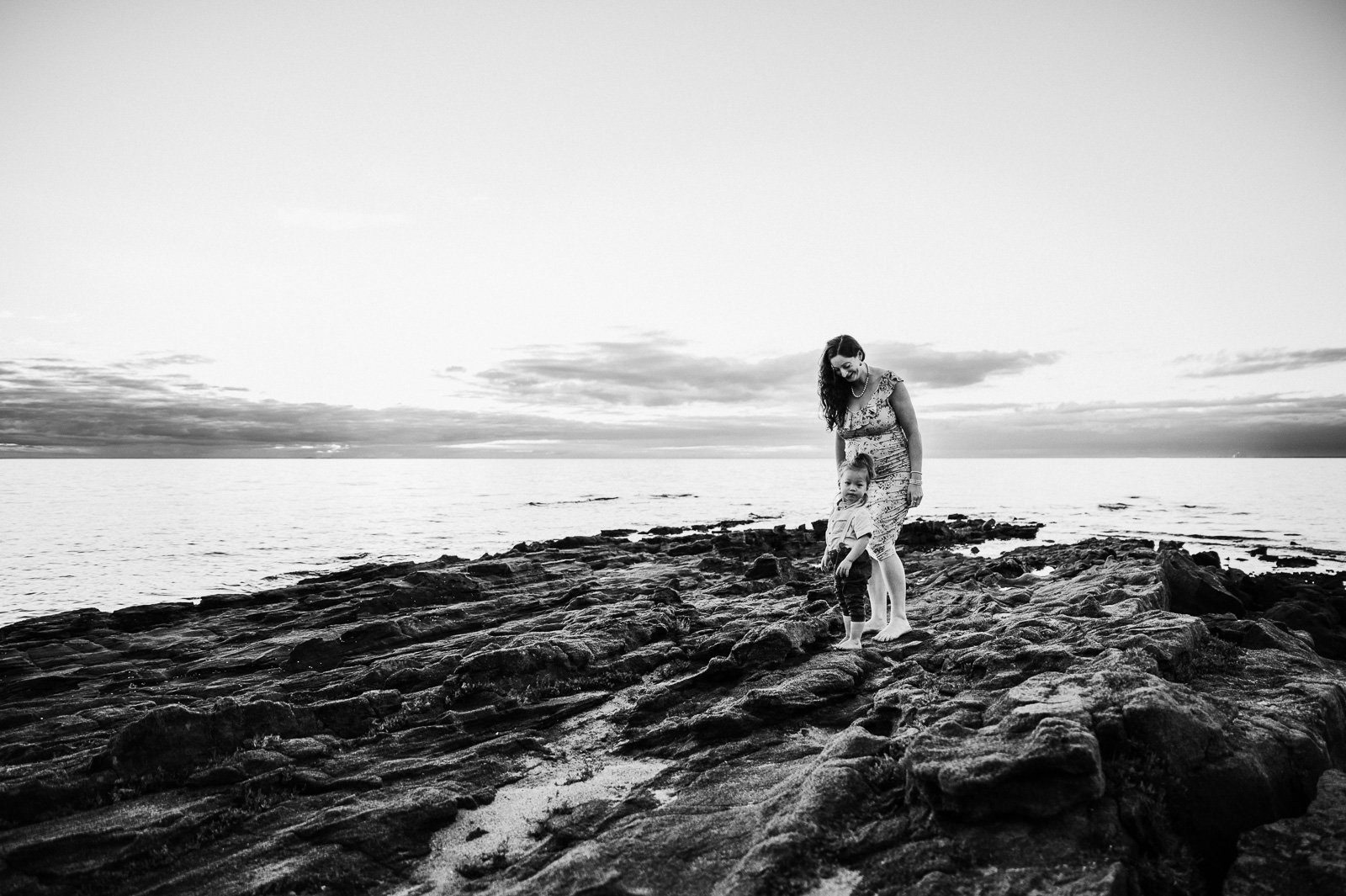 mother_and_toddler_on_rocks_sunset_black_and_whiite_pregnant_maternity_melbourne_photographer-1.jpg