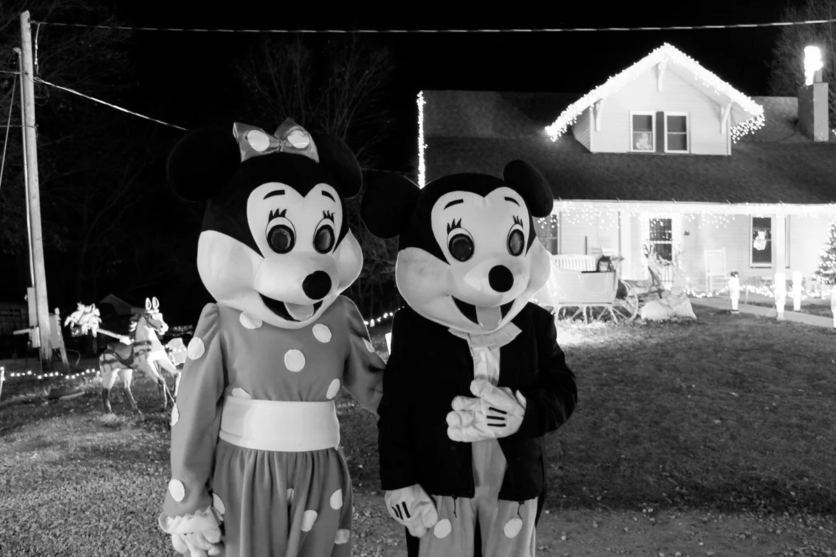 Portrait of Mr. and Mrs. Latchford in front of their Callao Christmas House.