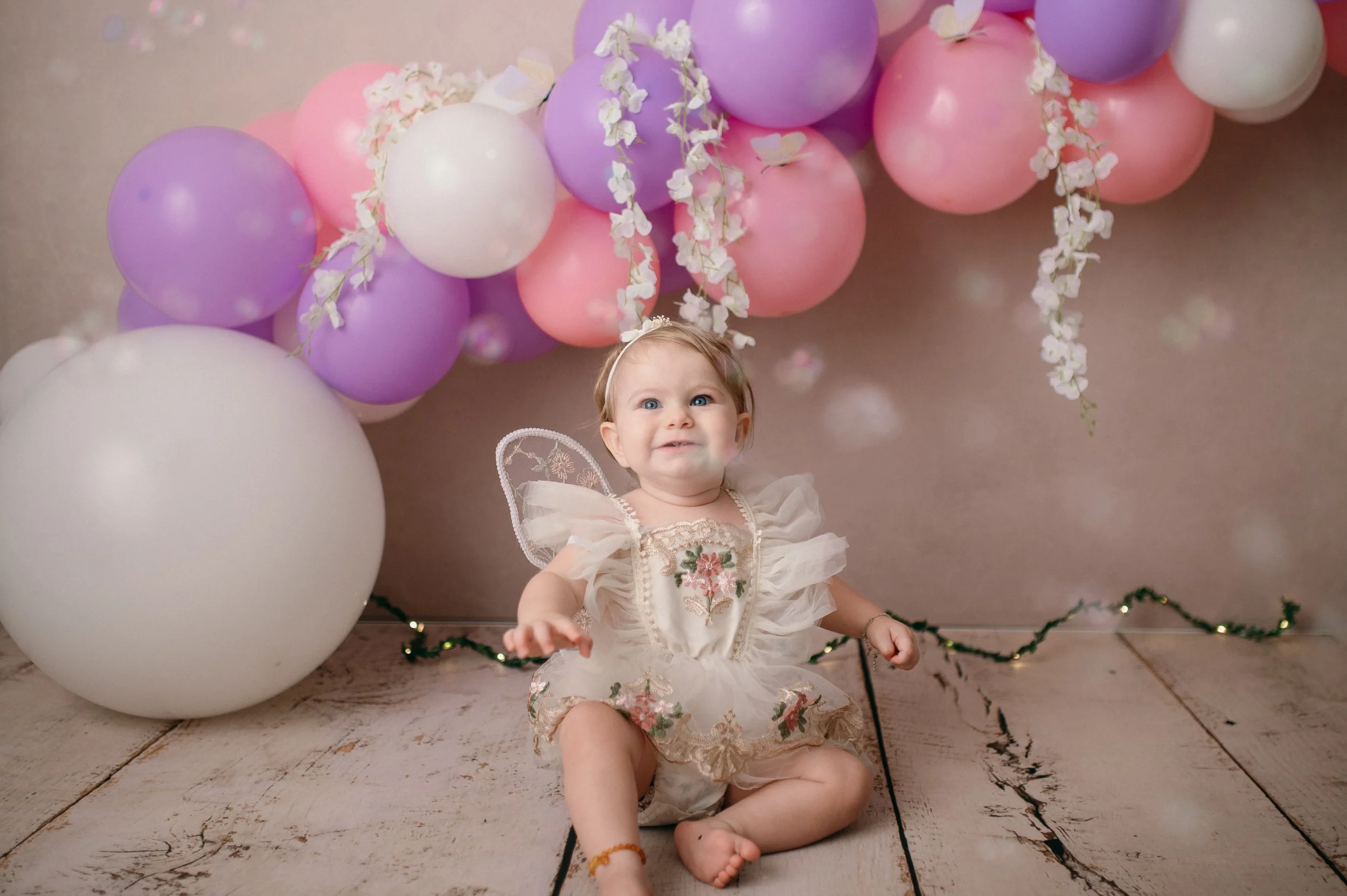 A baby having a first birthday photo