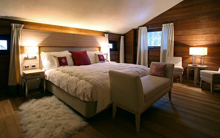 Guest Suite bedroom with wood paneling , custom designed headboard. 