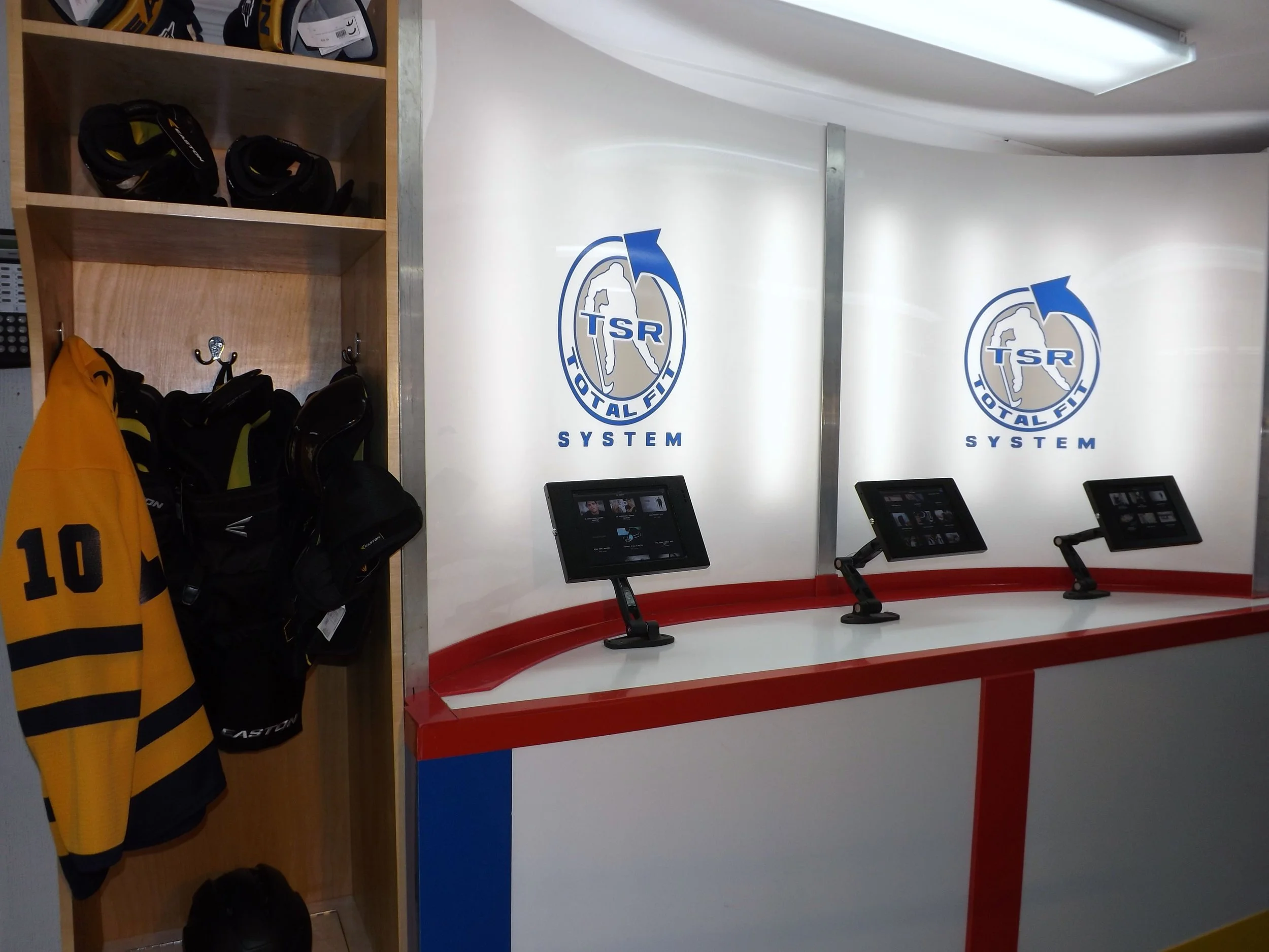 Information DisplayDesigned for TSR Hockey to inform customers on new products using vendor supplied clips &nbsp;on iPads.New merchandise displayed on each end of the display to encourage customer interaction.Concept and design 