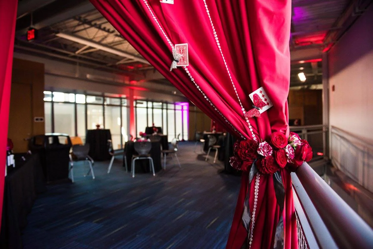 Assorted drapery available in white, black, red (shown), burgundy, grey.