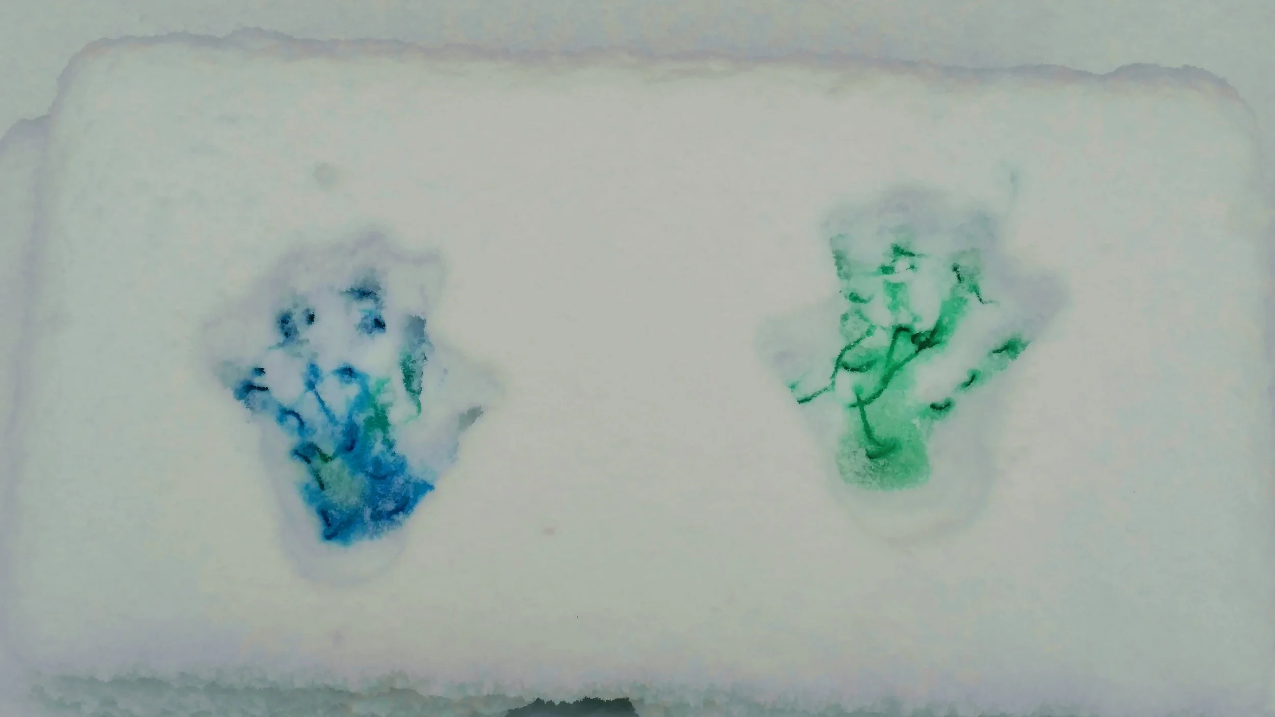 Painted hand prints in the snow.