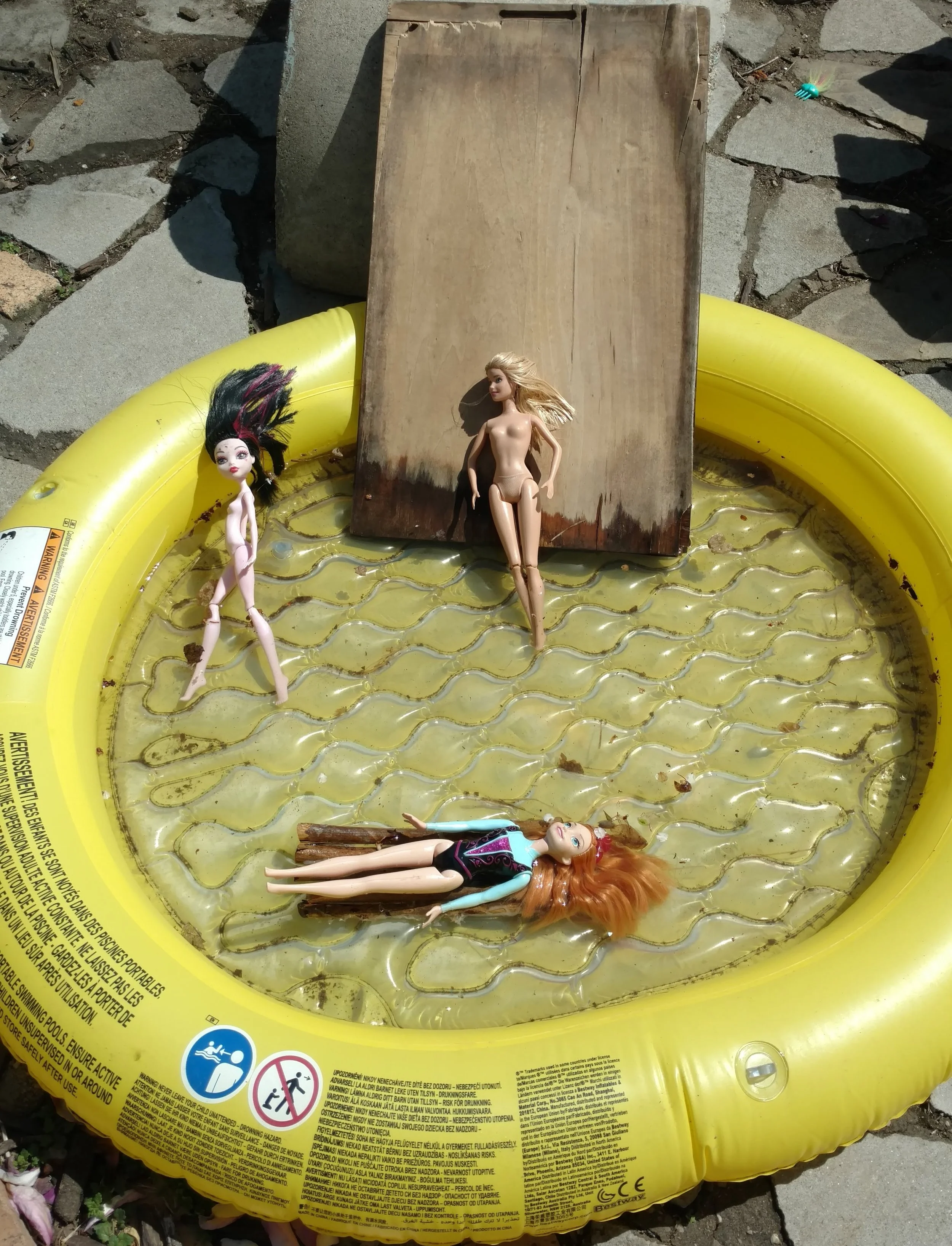 Hot glue gun and stick raft for the Barbies.