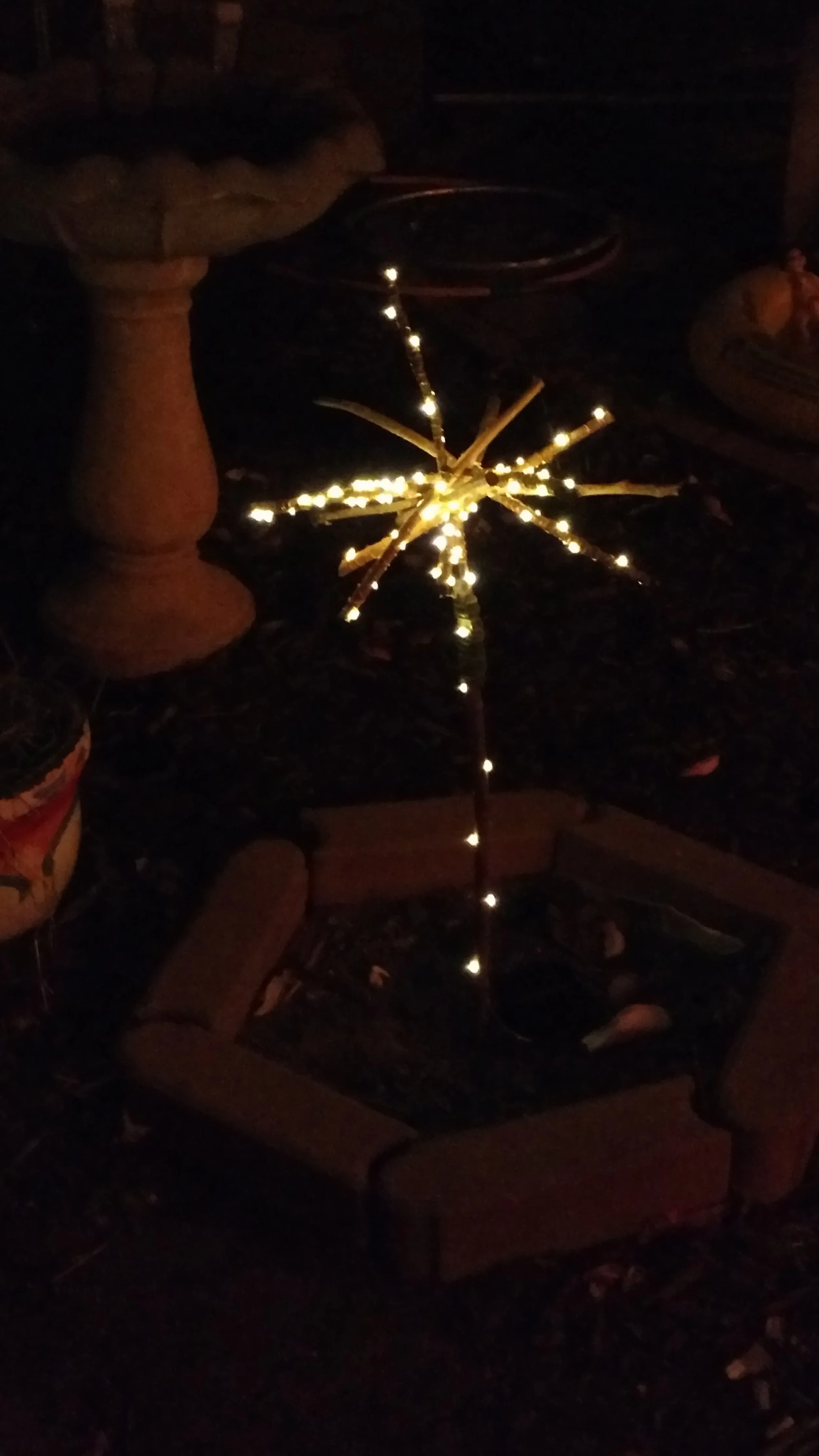 Copper string light garden art sculpture.