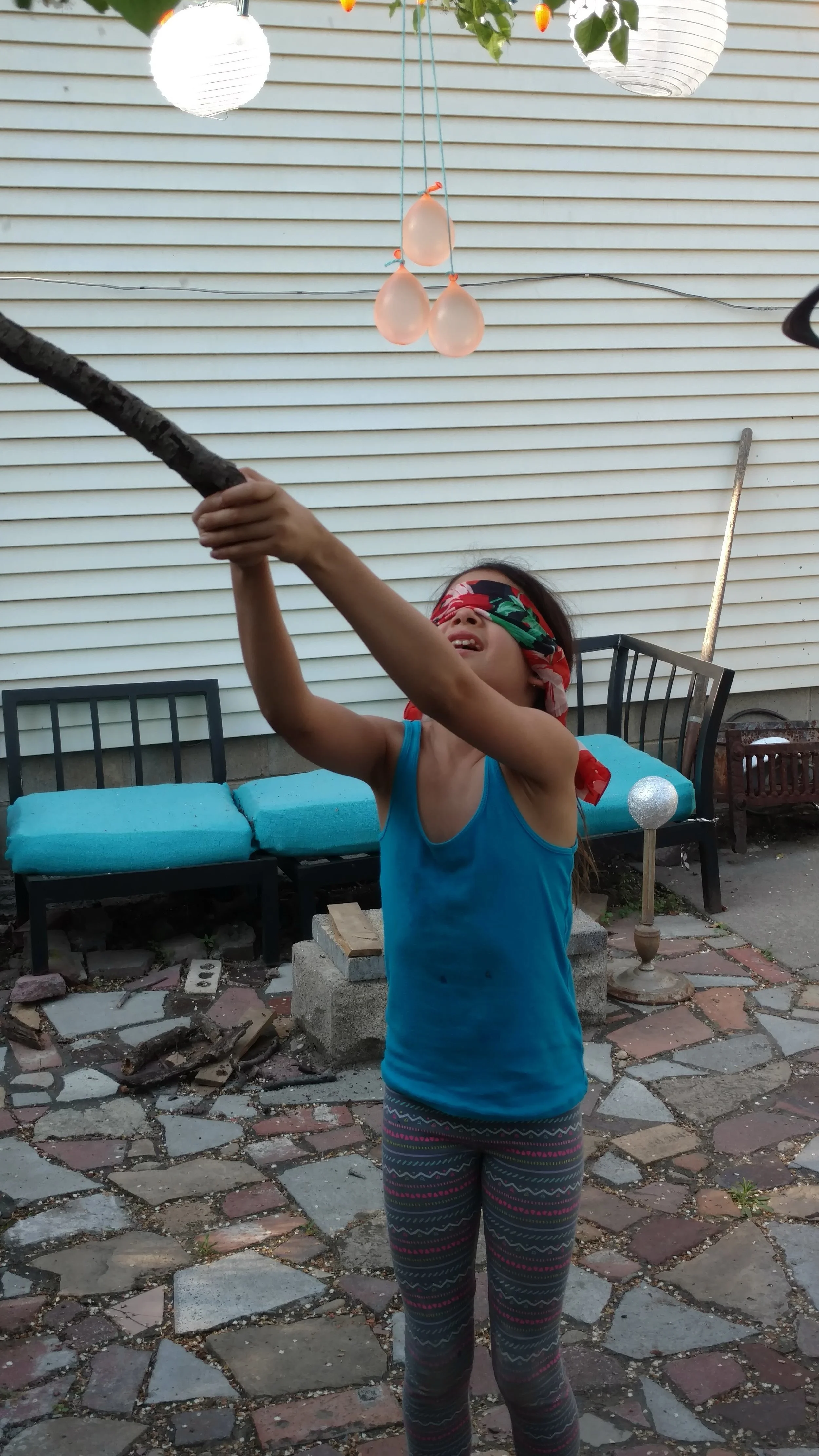 Ruby's turn trying to hit the water balloon pinata.