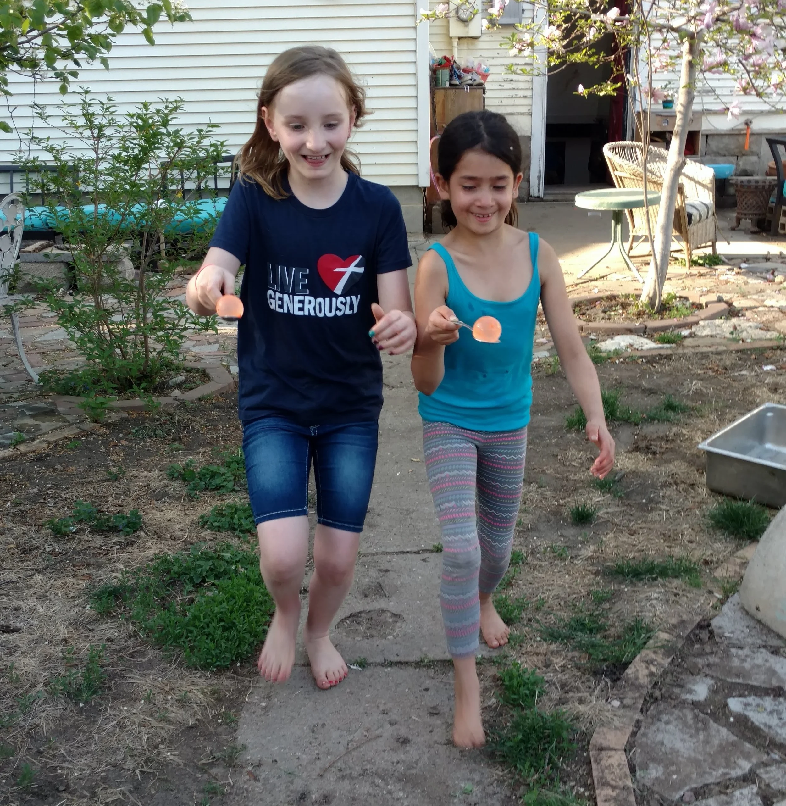 Water balloon spoon race.