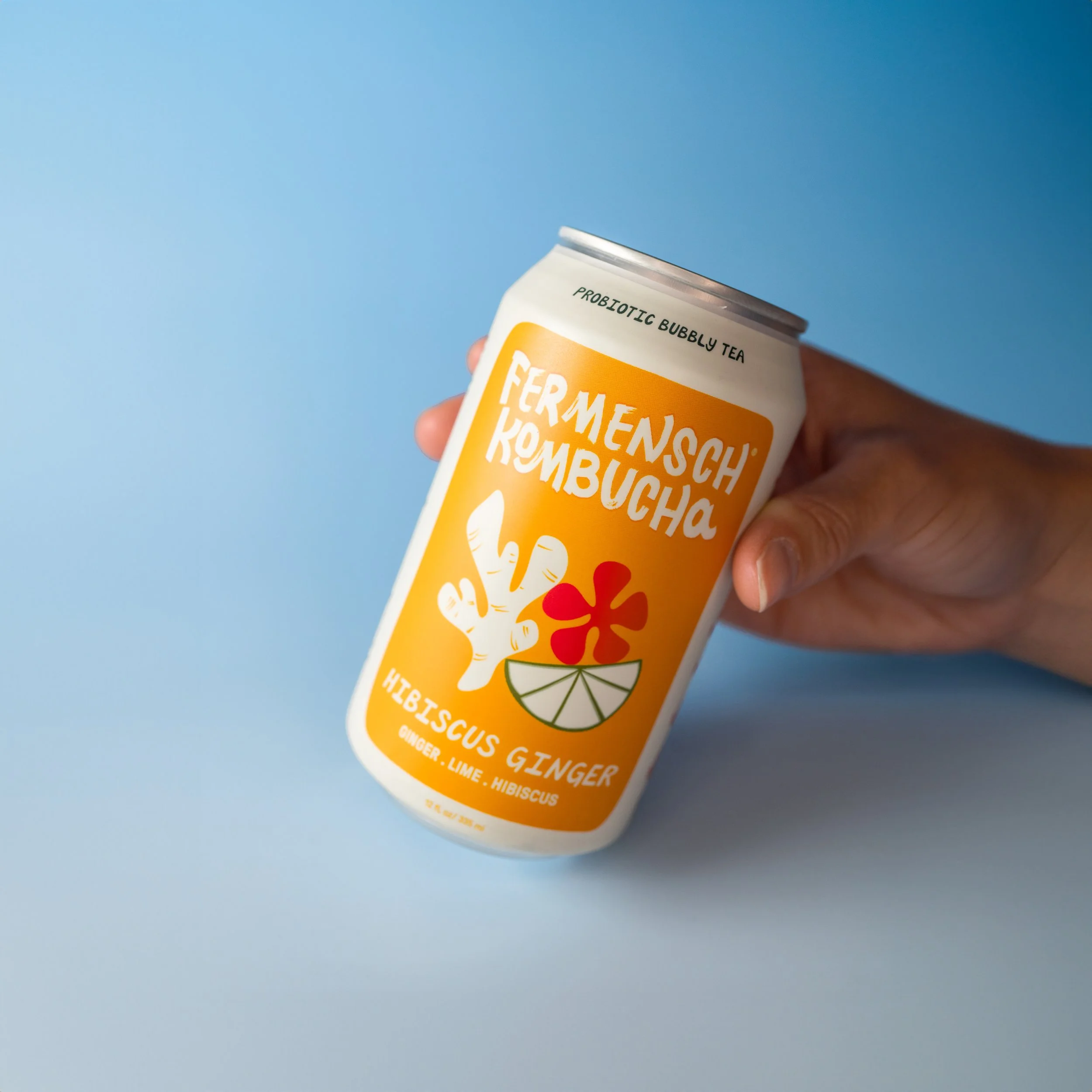 Hibiscus Ginger Can Balanced on Blue- Femensch Kombucha.jpg