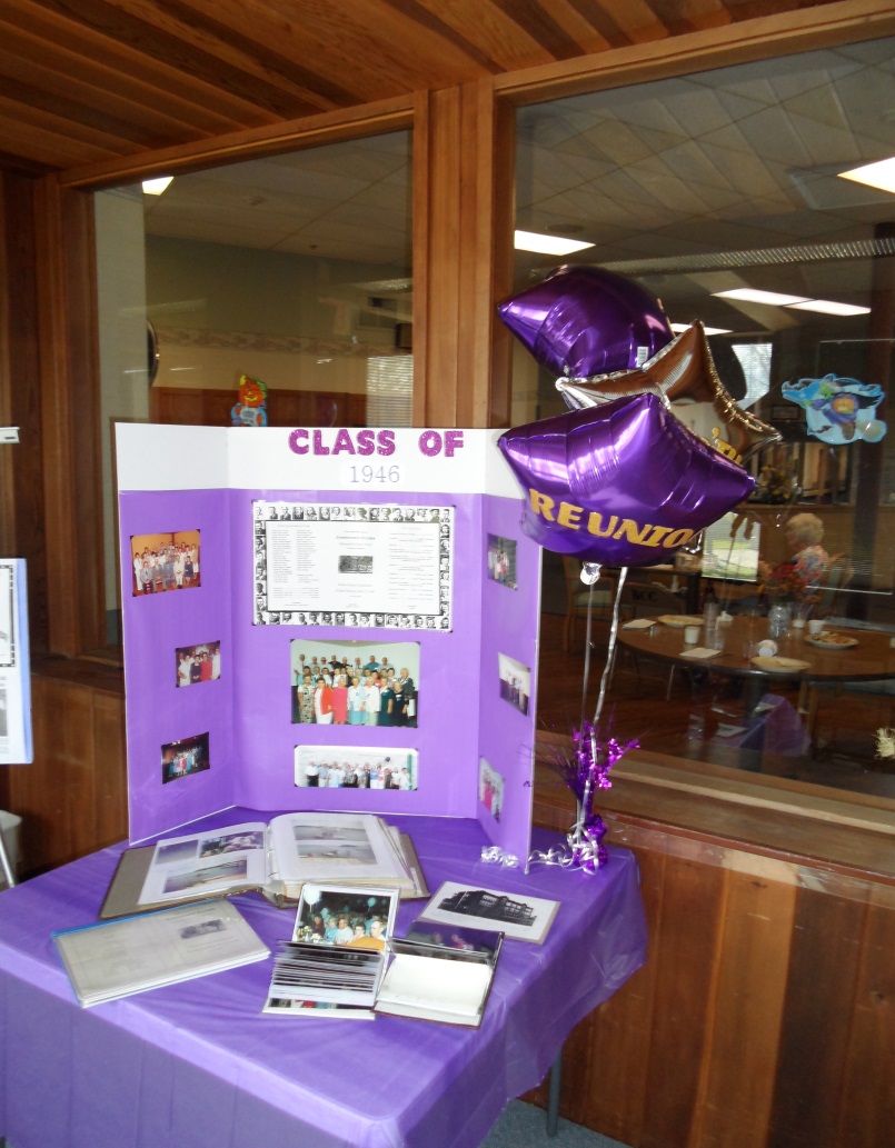 A display table of photos at the class of 1946 reunion sparked many memories! 