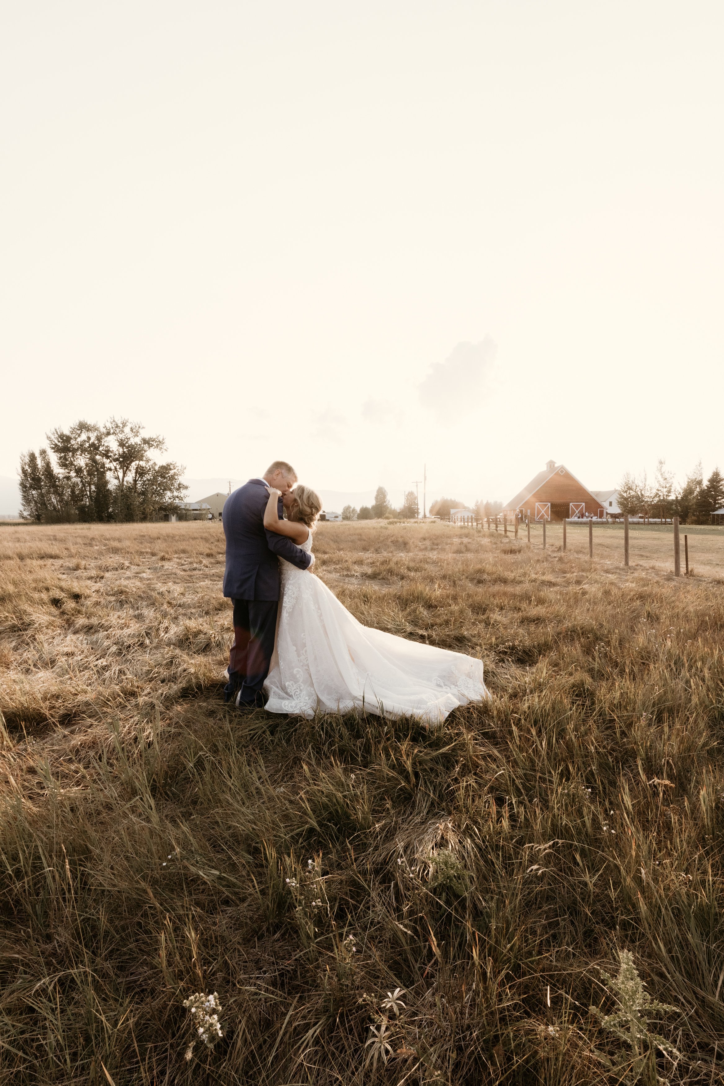 Bride and Groom in Field at Golden Hour